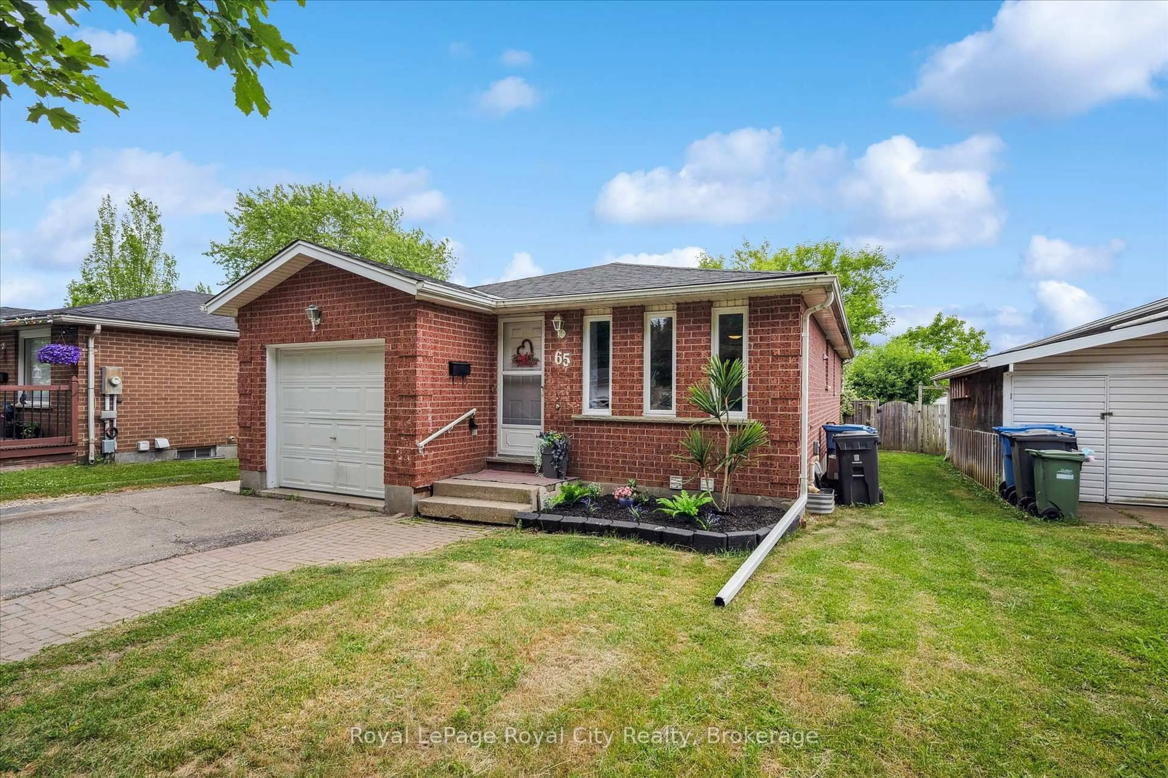 Home with brick exterior material, street for 65 Eastview Rd, Guelph Ontario N1E 6K5