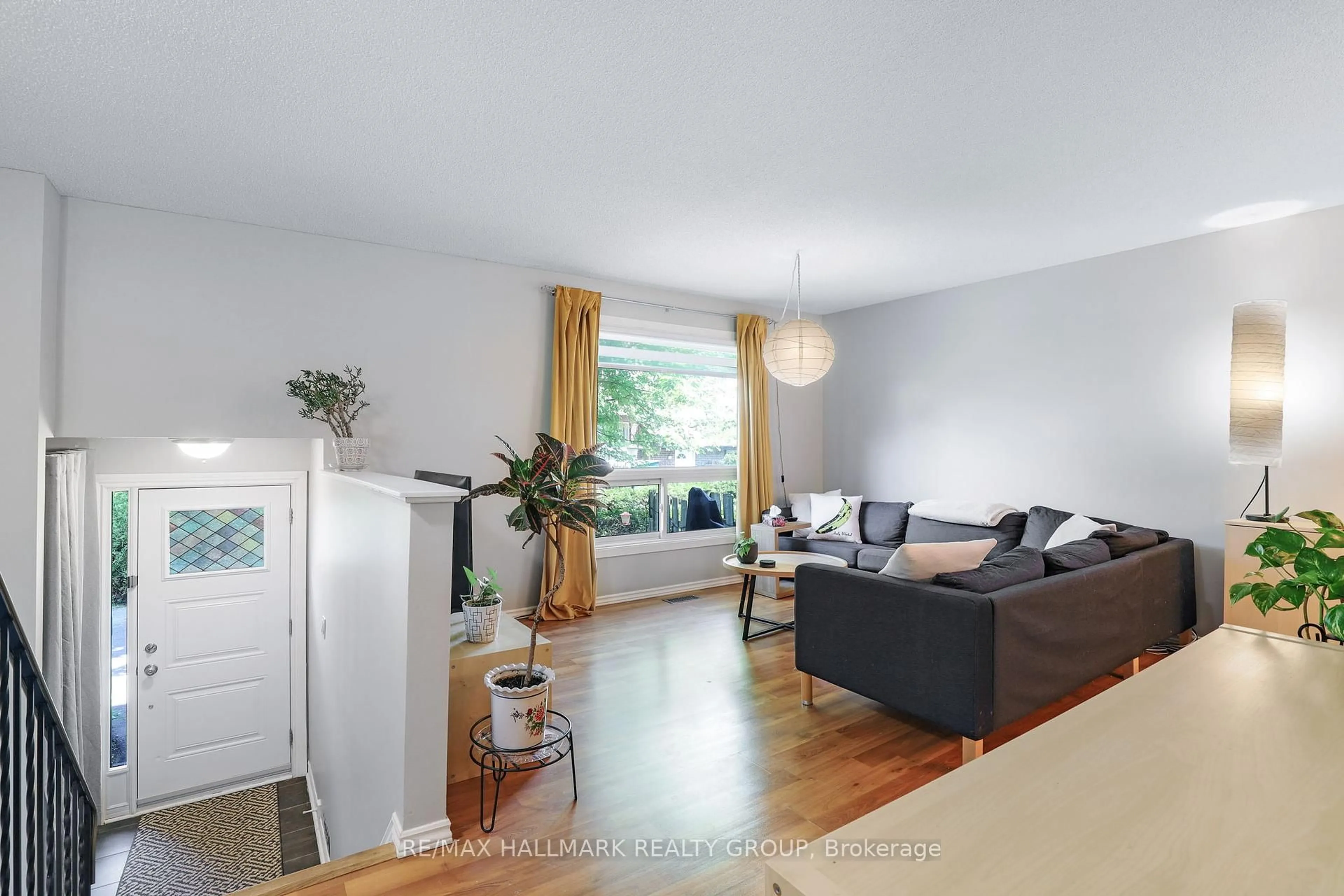 Living room with furniture, wood/laminate floor for 405 Montfort St #8, Ottawa Ontario K1L 8G8