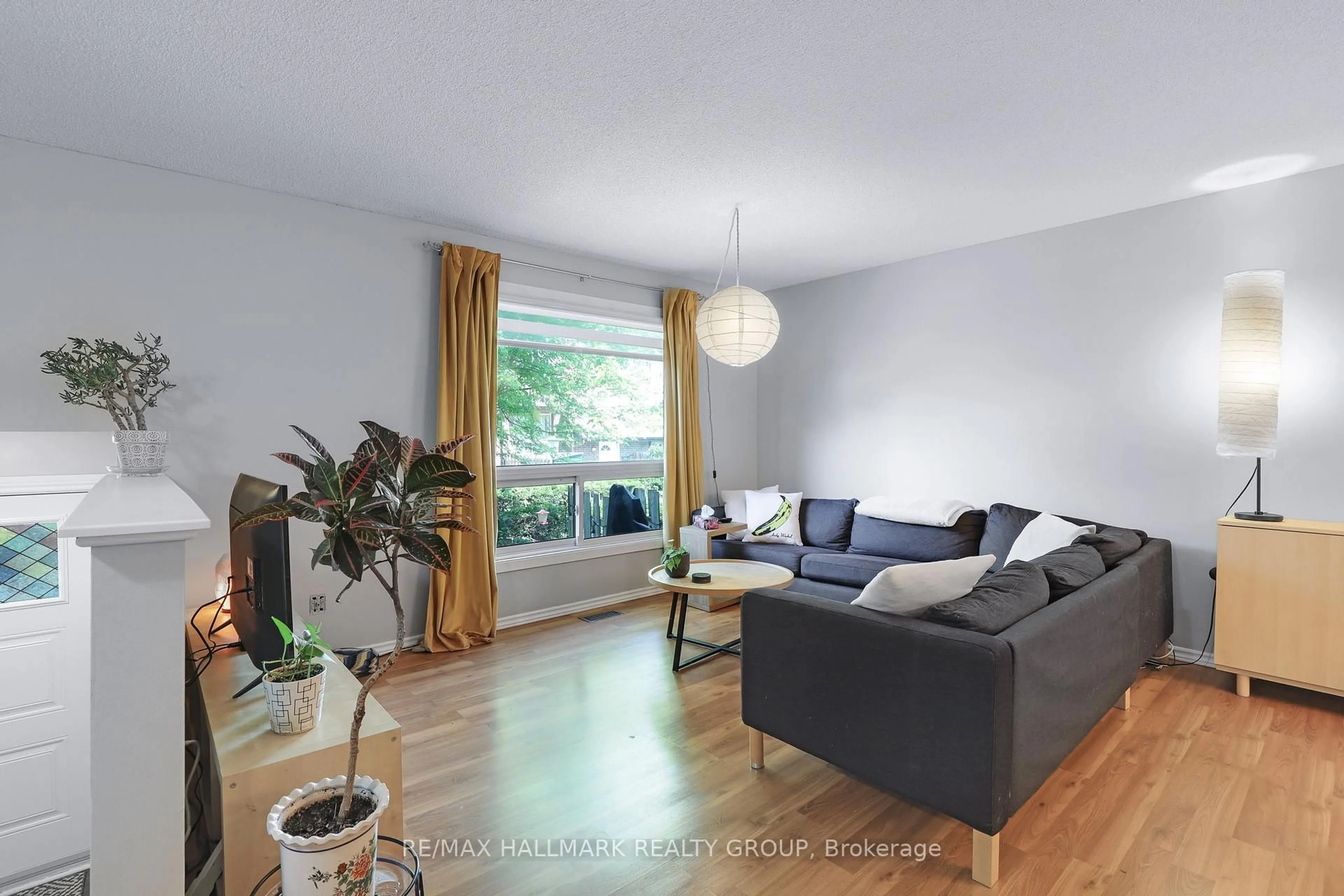 Living room with furniture, wood/laminate floor for 405 Montfort St #8, Ottawa Ontario K1L 8G8