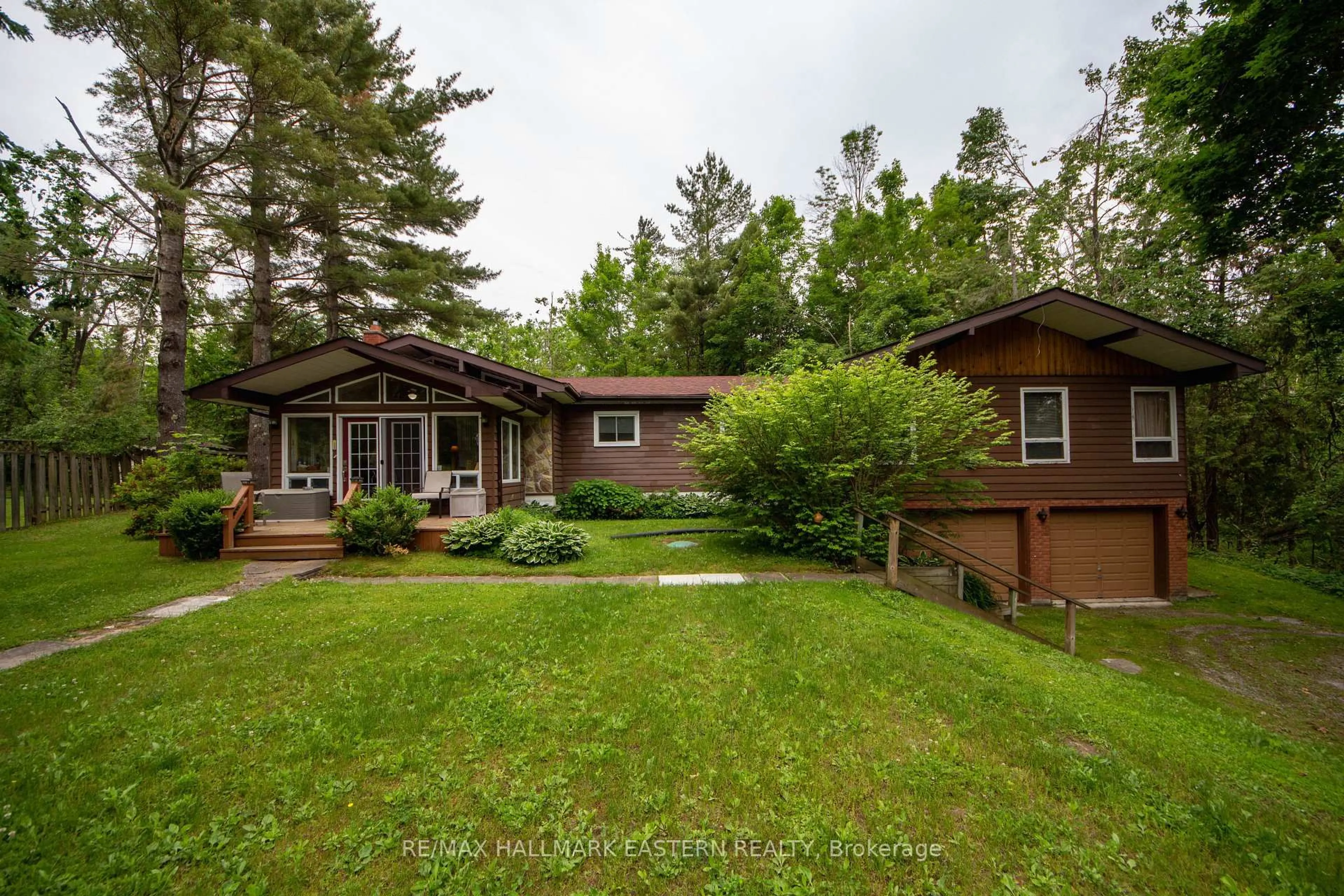 A pic from outside/outdoor area/front of a property/back of a property/a pic from drone, forest/trees view for 12 Alpine Cres, Trent Lakes Ontario K0M 1A0