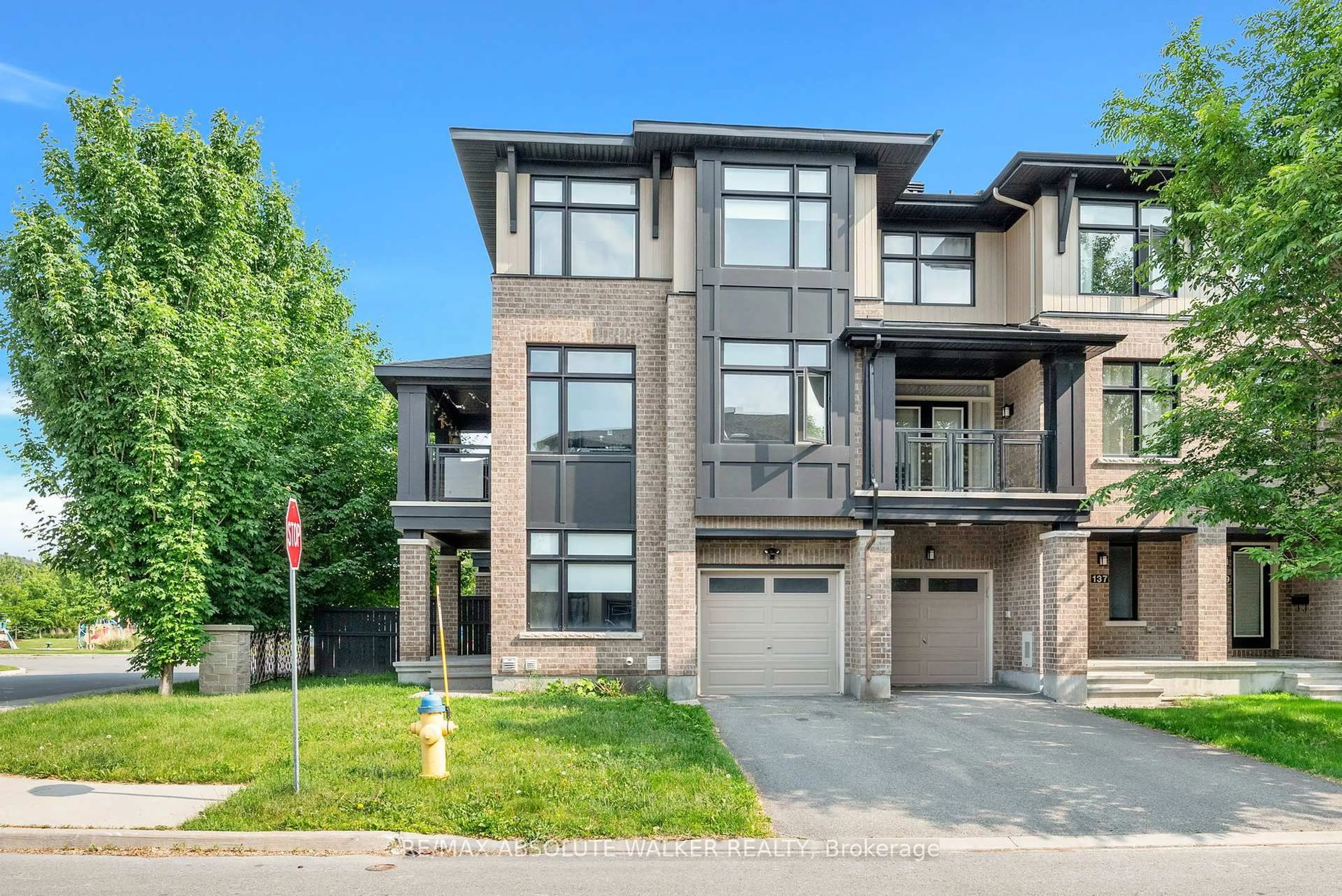 Home with brick exterior material, street for 135 Wild Senna Way, Ottawa Ontario K2J 5Z7