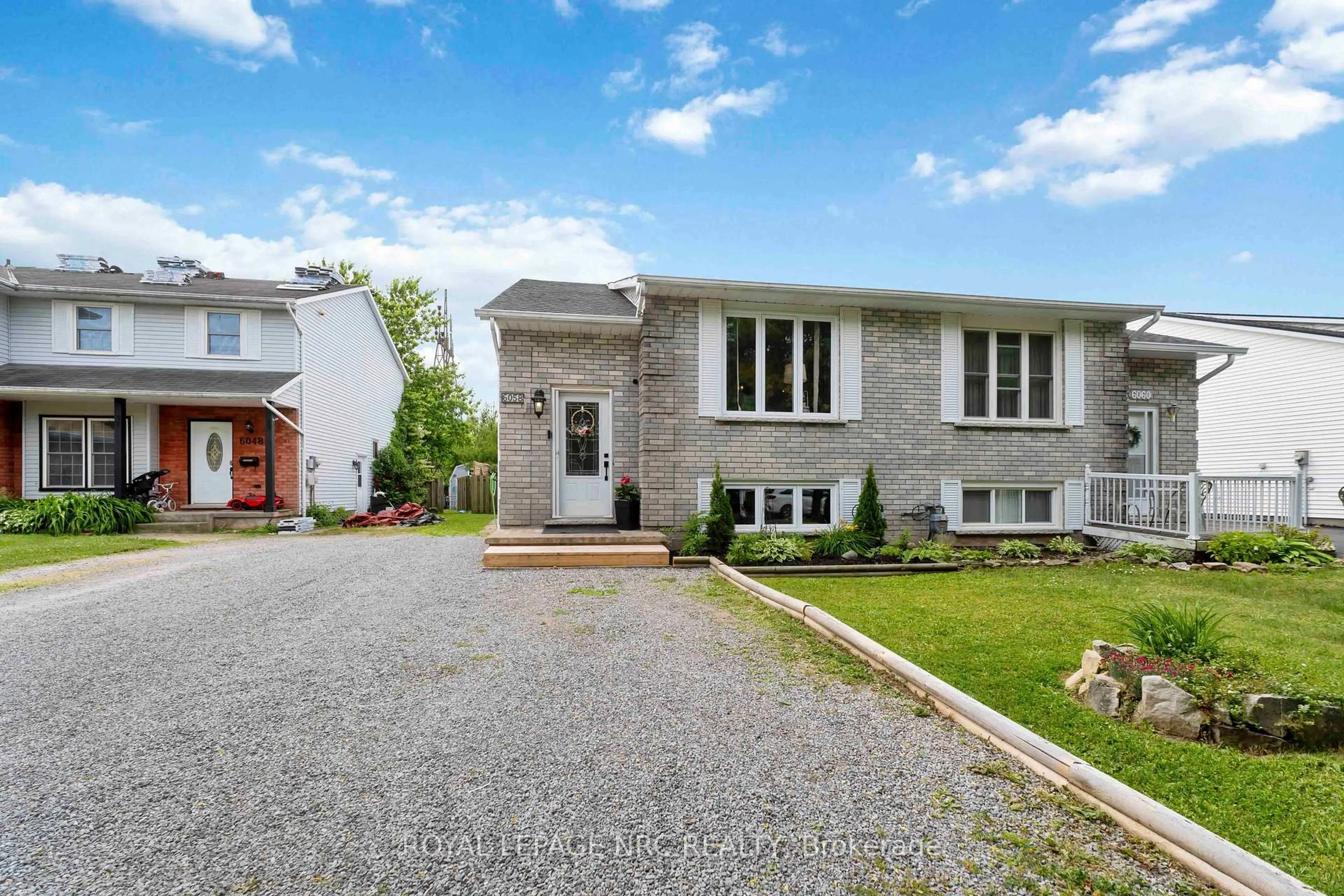 Home with brick exterior material, street for 6058 WILDROSE Cres, Niagara Falls Ontario L2G 7T2