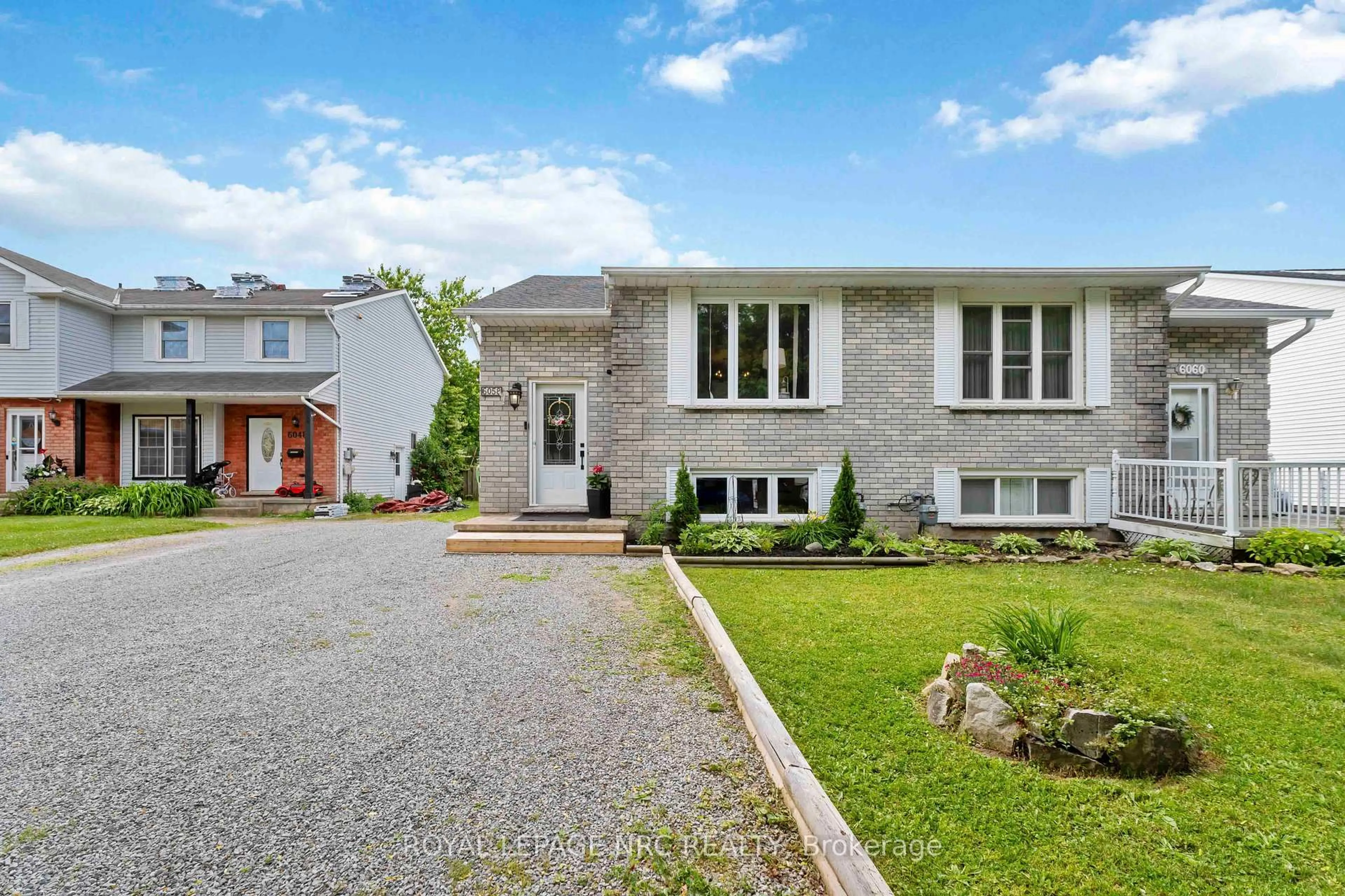 Home with brick exterior material, street for 6058 WILDROSE Cres, Niagara Falls Ontario L2G 7T2