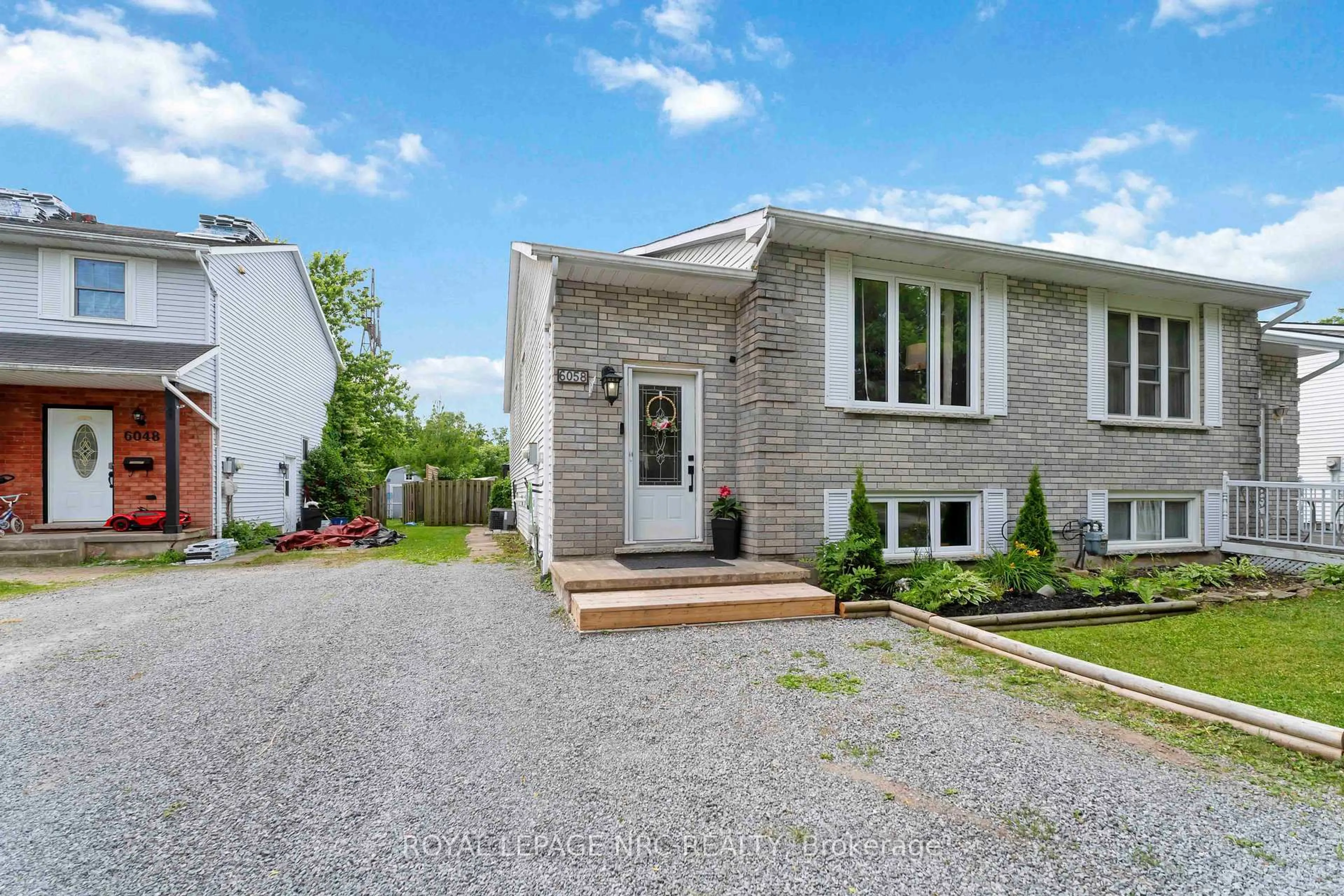 Home with brick exterior material, street for 6058 WILDROSE Cres, Niagara Falls Ontario L2G 7T2