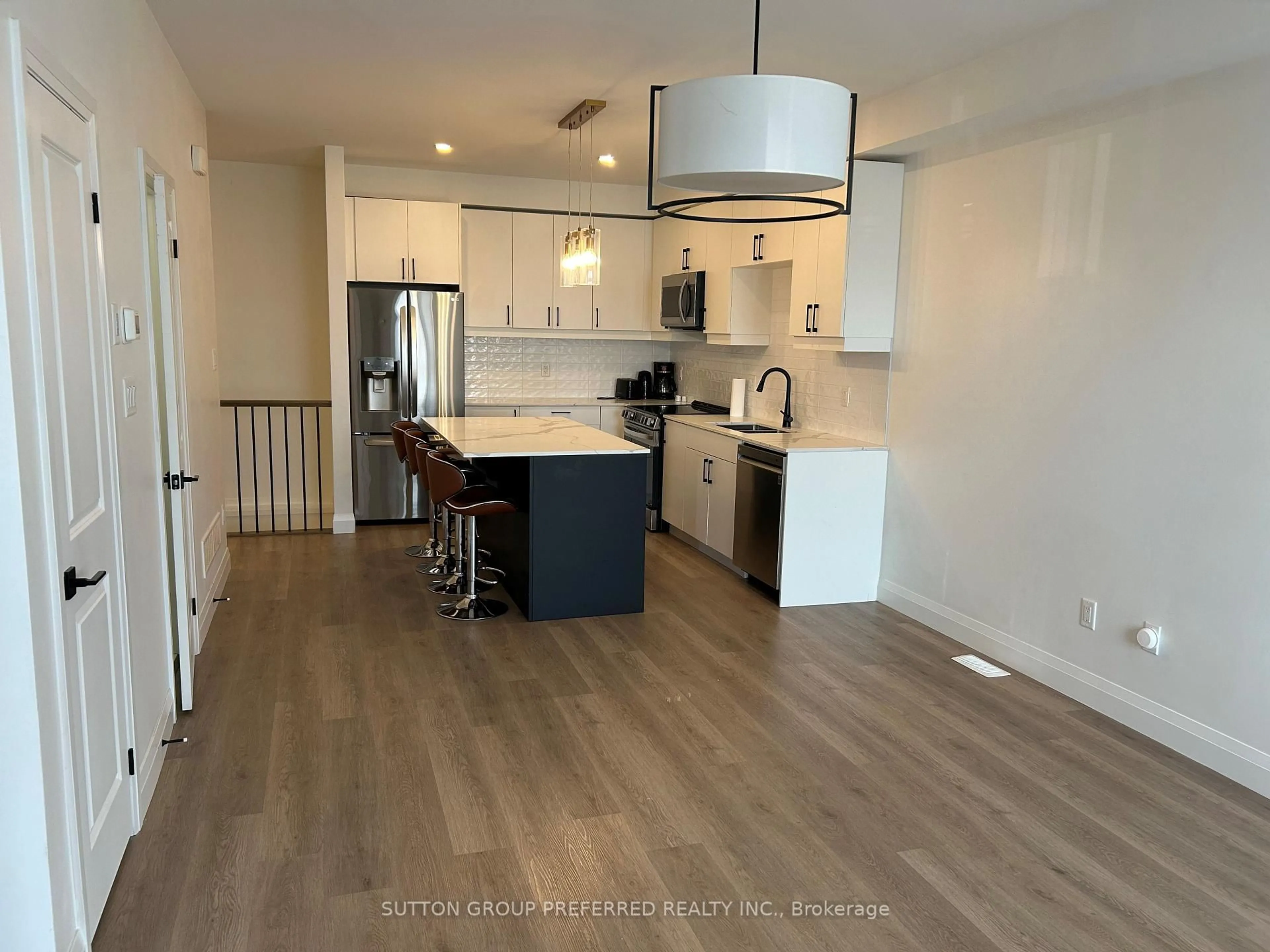 Open concept kitchen, wood/laminate floor for 3900 Savoy St #191, London South Ontario N6P 0H9