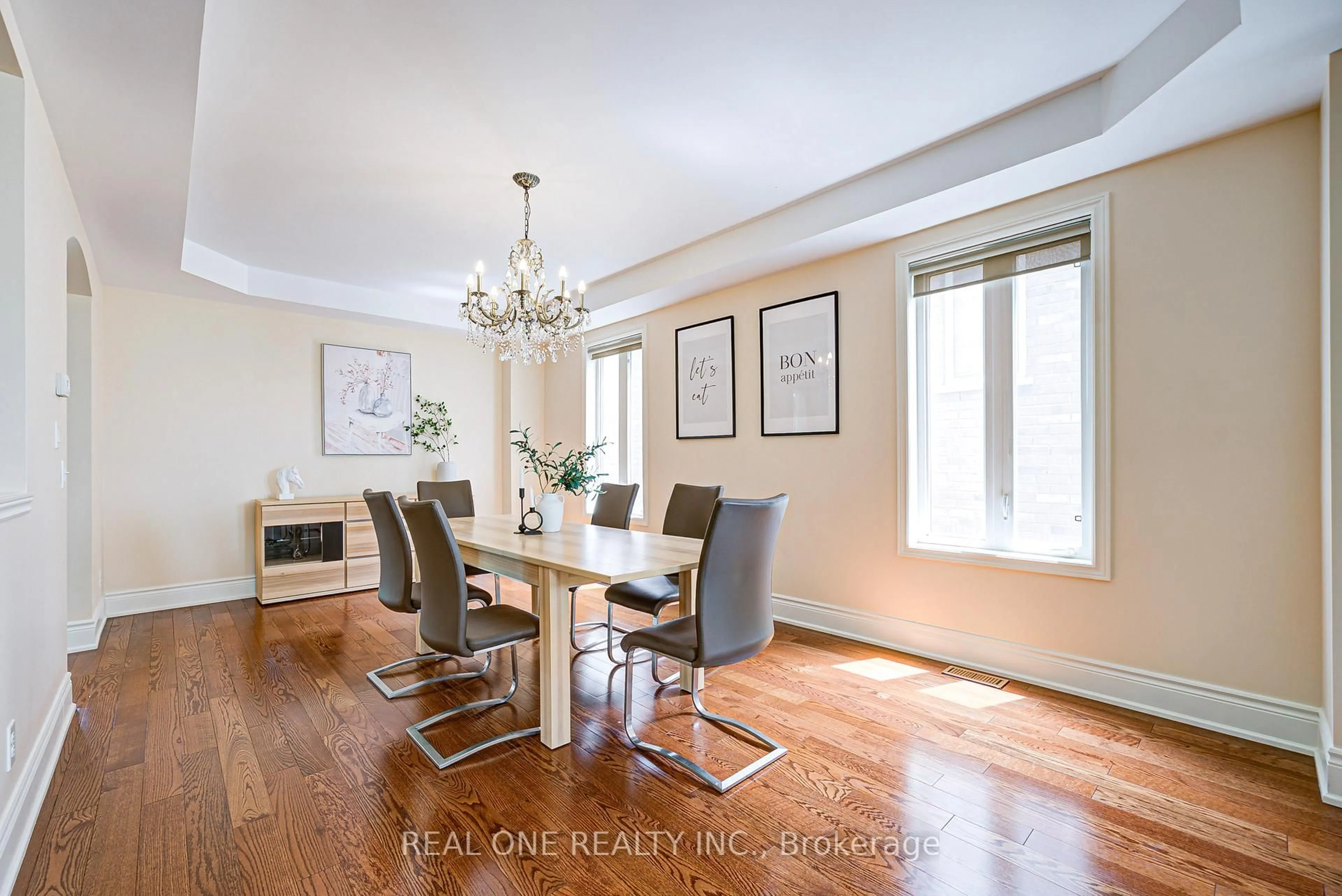 Dining room, wood/laminate floor for 112 Sutherland Cres, Hamilton Ontario L9K 0H2