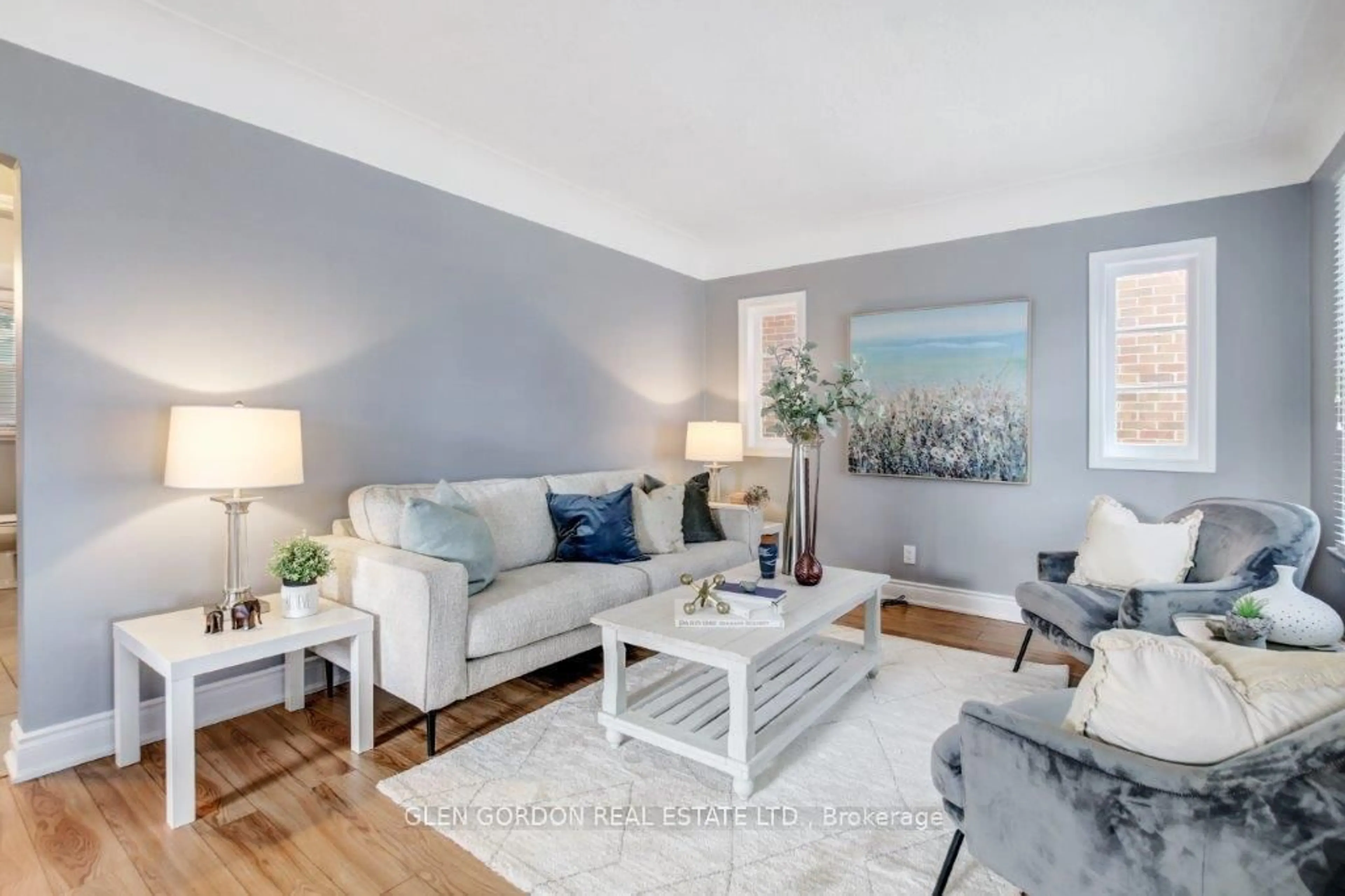 Living room with furniture, wood/laminate floor for 597 Victoria St, London East Ontario N5Y 4B9