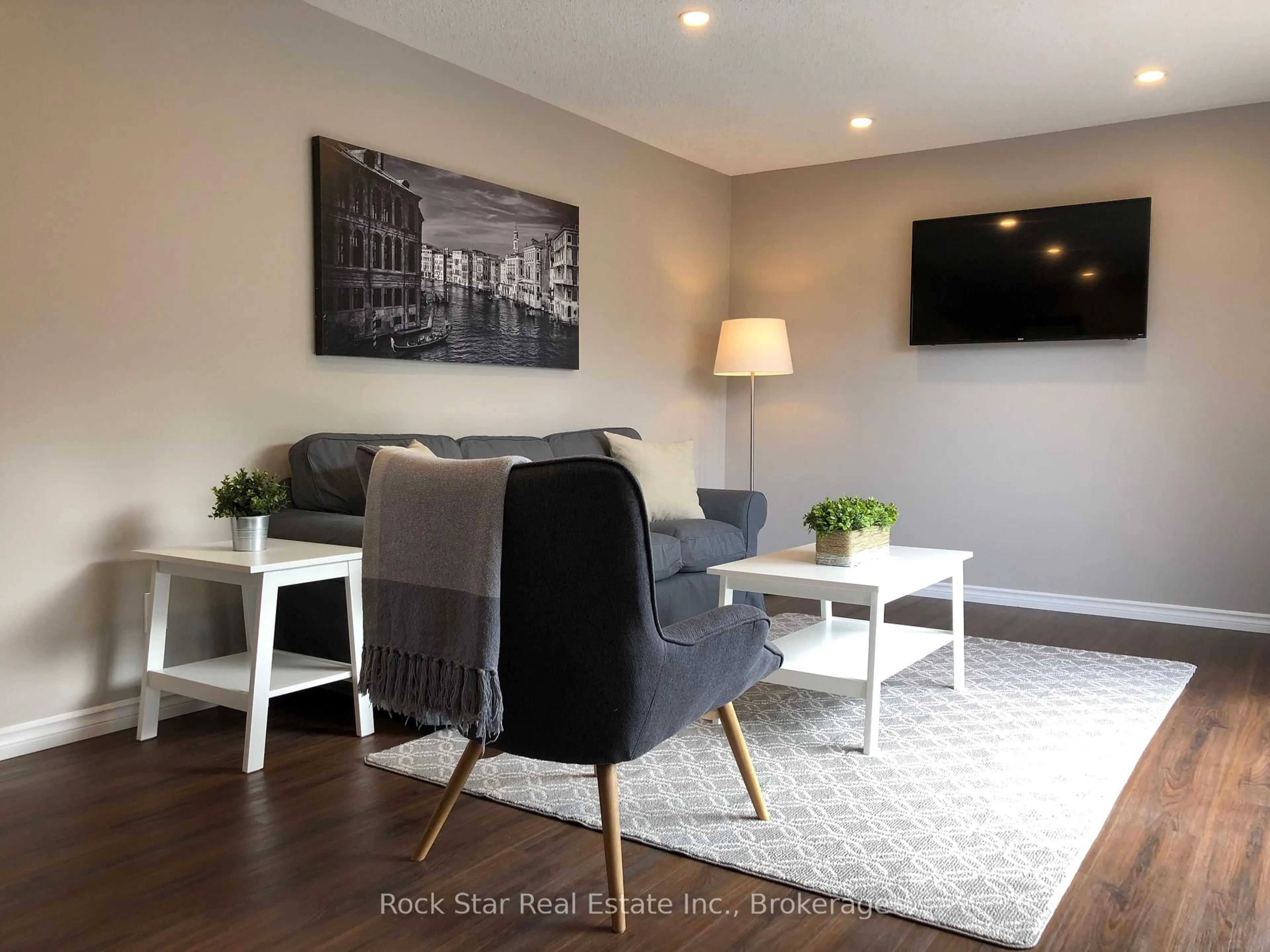 Living room with furniture, wood/laminate floor for 84 Maple Dr, Belleville Ontario K8P 2R2