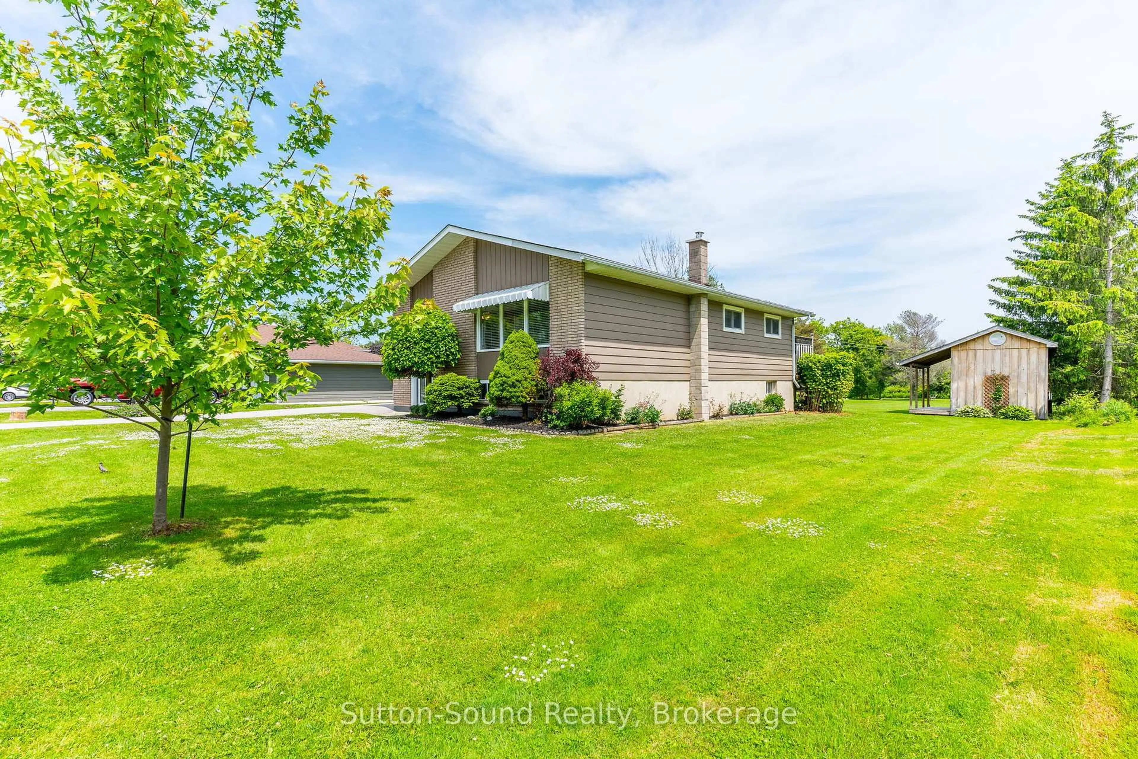 A pic from outside/outdoor area/front of a property/back of a property/a pic from drone, water/lake/river/ocean view for 377 Somers St, Georgian Bluffs Ontario N4K 6V5