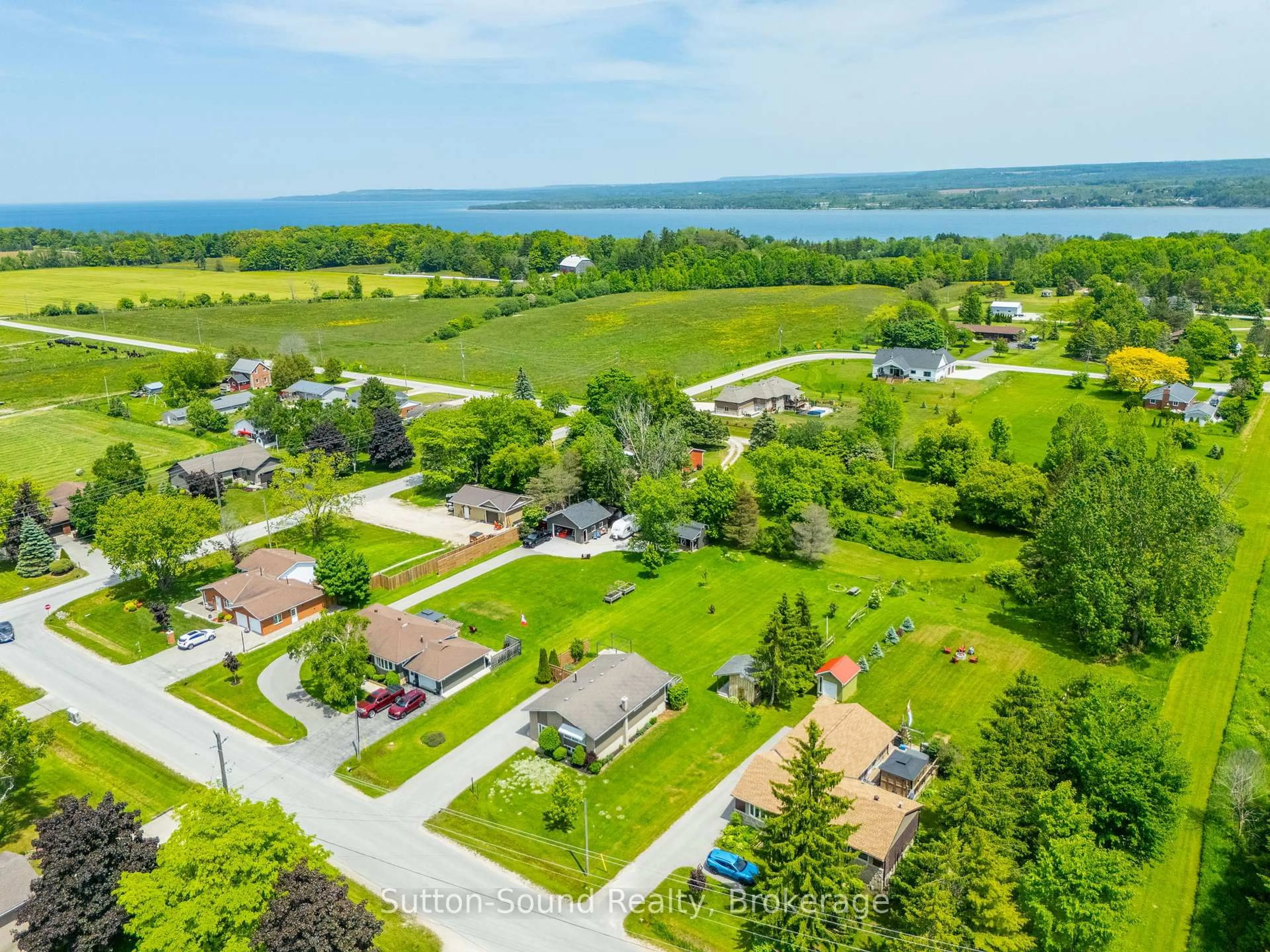 A pic from outside/outdoor area/front of a property/back of a property/a pic from drone, water/lake/river/ocean view for 377 Somers St, Georgian Bluffs Ontario N4K 6V5