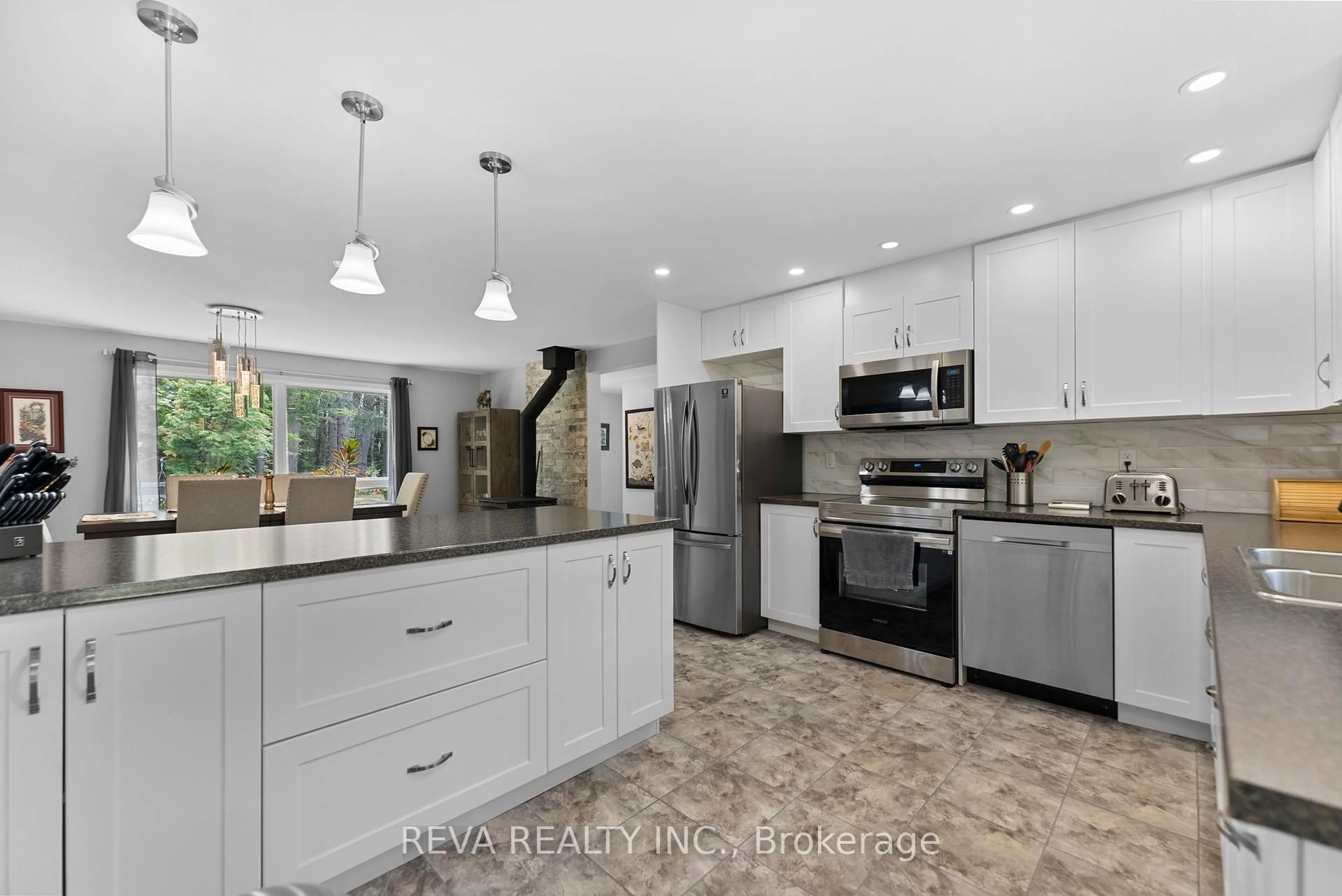 Open concept kitchen, ceramic/tile floor for 32 Papineau Lake Rd, Maple Leaf Ontario K0L 2R0