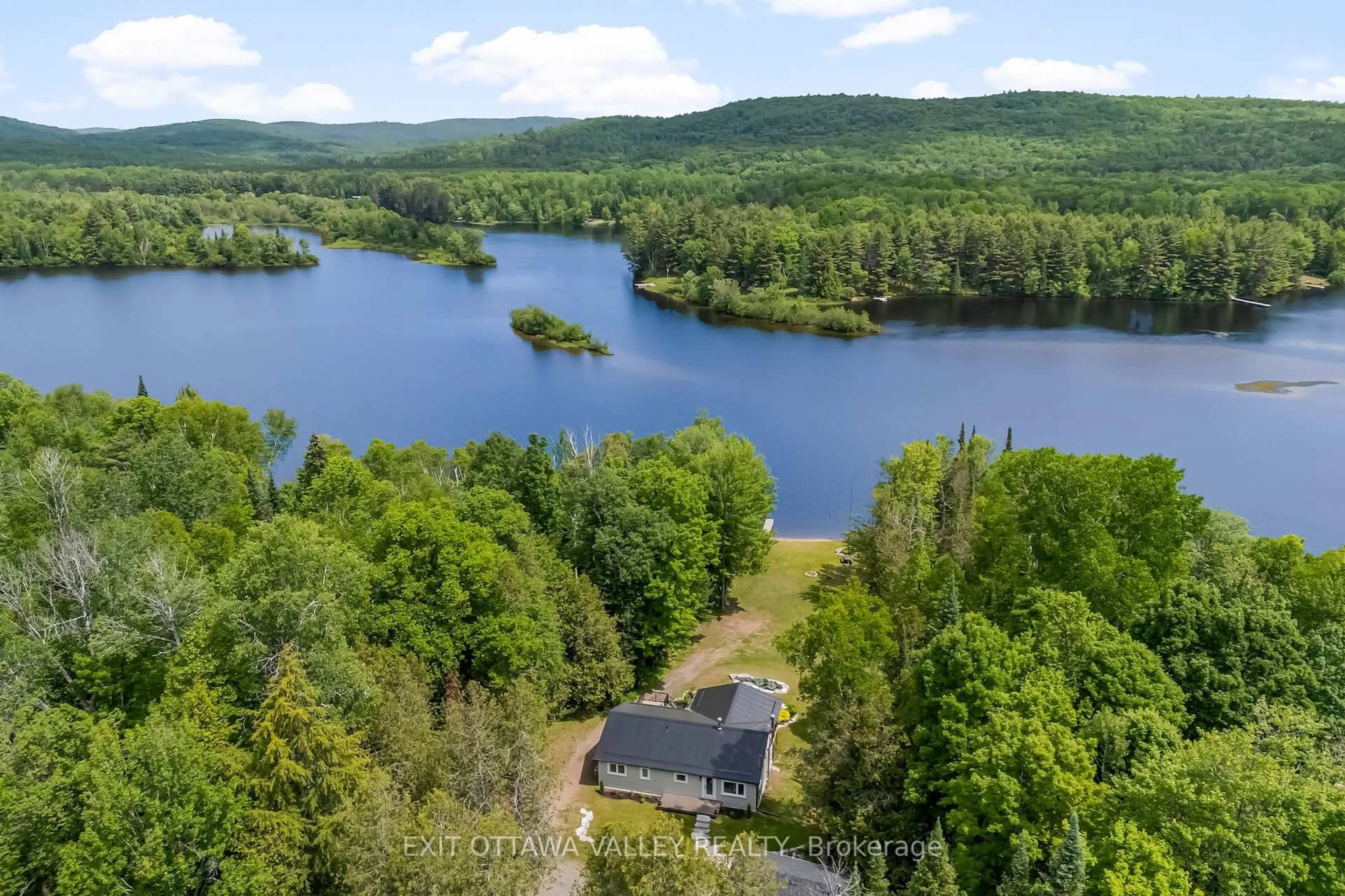 A pic from outside/outdoor area/front of a property/back of a property/a pic from drone, water/lake/river/ocean view for 1478 Kamaniskeg Lk Rd, Combermere Ontario K0J 1L0