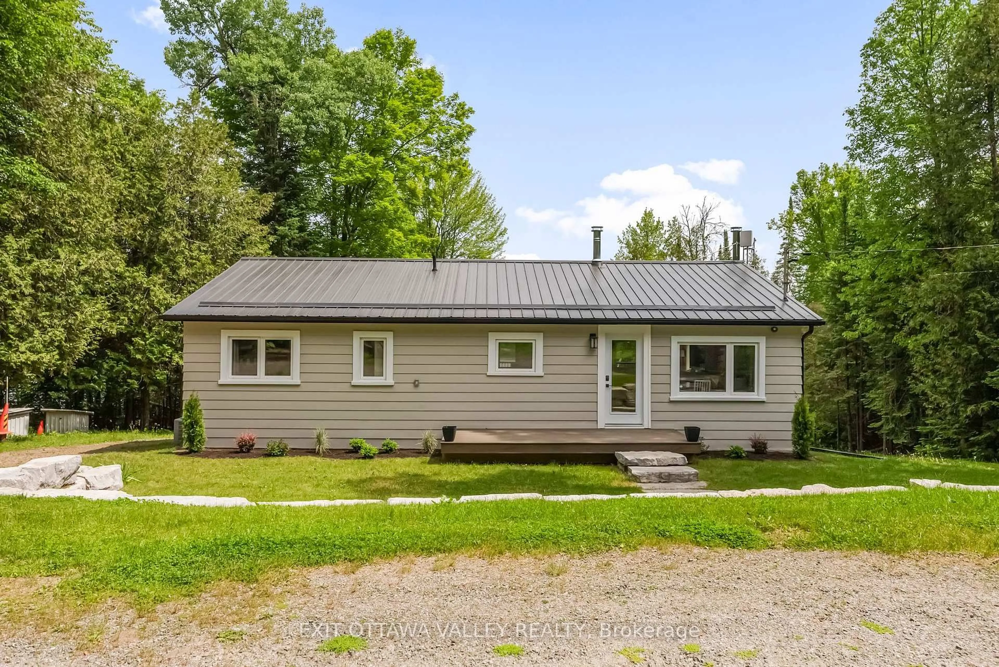 Home with vinyl exterior material, street for 1478 Kamaniskeg Lk Rd, Combermere Ontario K0J 1L0