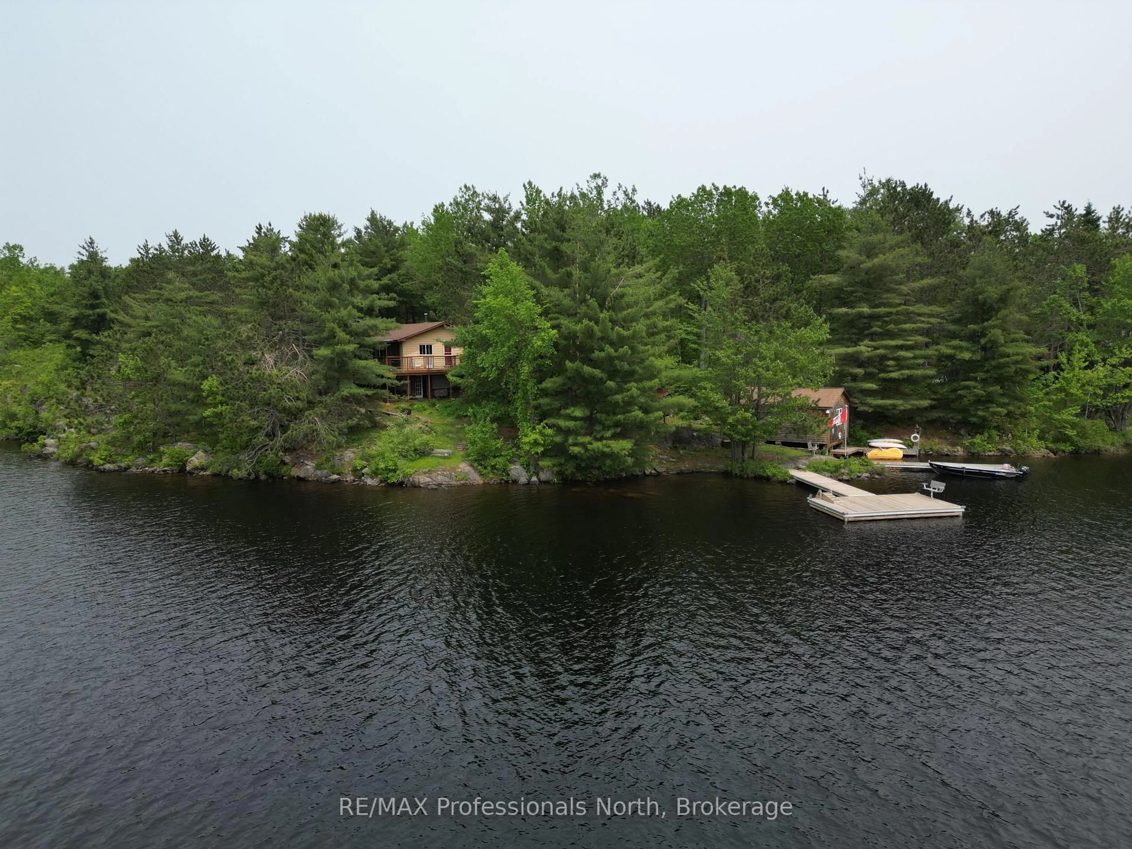 A pic from outside/outdoor area/front of a property/back of a property/a pic from drone, water/lake/river/ocean view for 11437 Devils Lake WAO, Minden Hills Ontario K0M 2L1