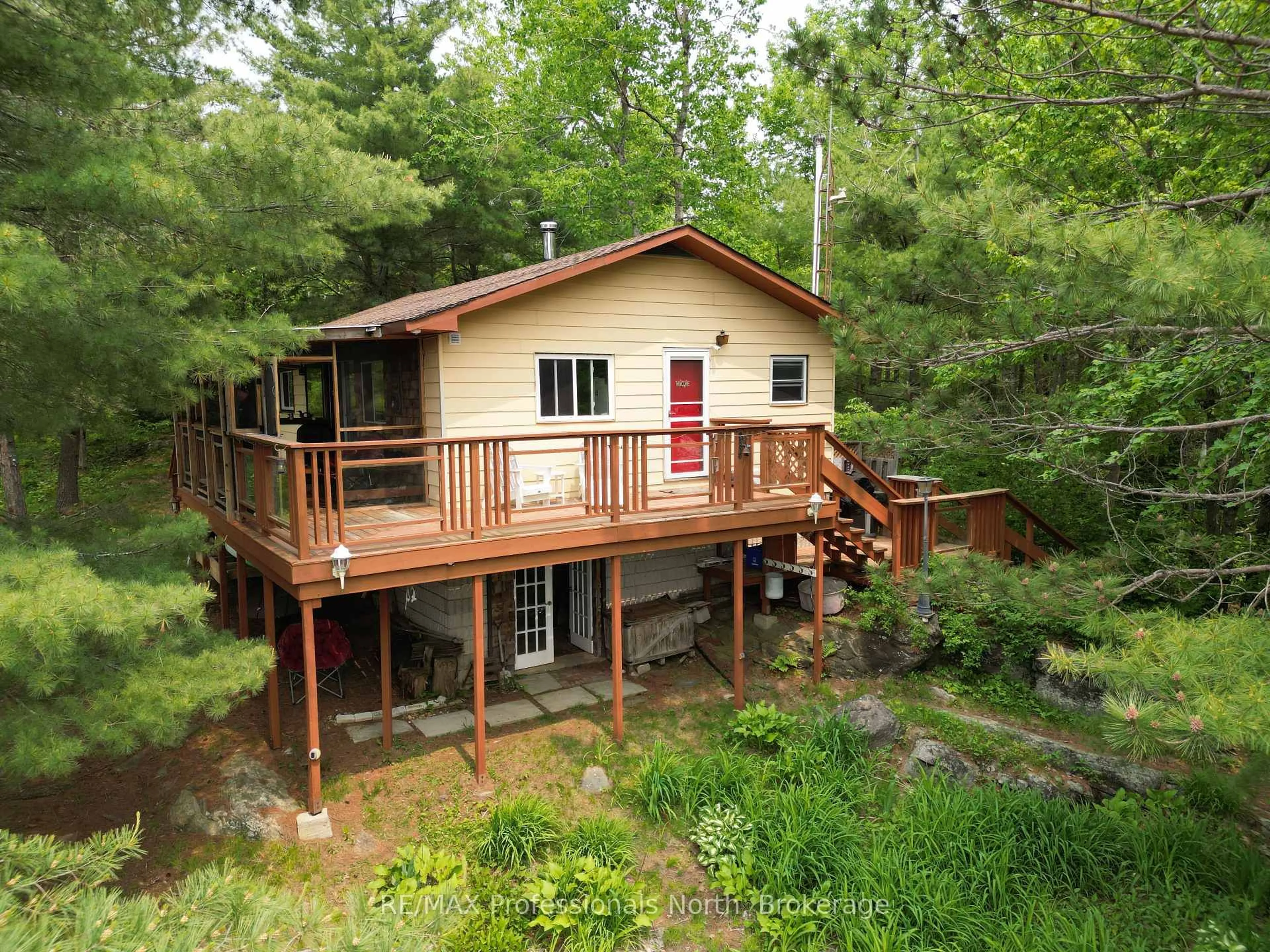 A pic from outside/outdoor area/front of a property/back of a property/a pic from drone, water/lake/river/ocean view for 11437 Devils Lake WAO, Minden Hills Ontario K0M 2L1