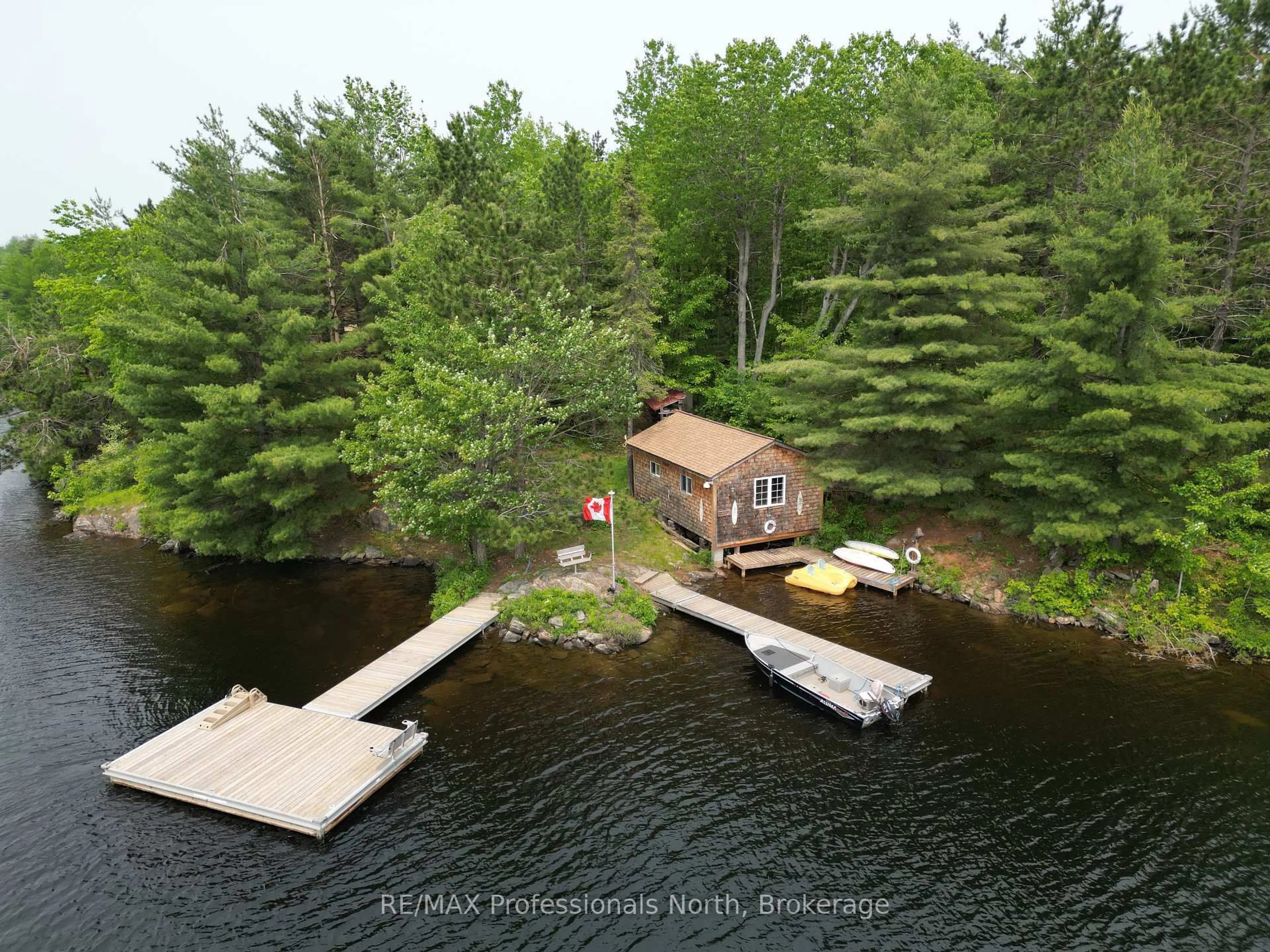 A pic from outside/outdoor area/front of a property/back of a property/a pic from drone, water/lake/river/ocean view for 11437 Devils Lake WAO, Minden Hills Ontario K0M 2L1