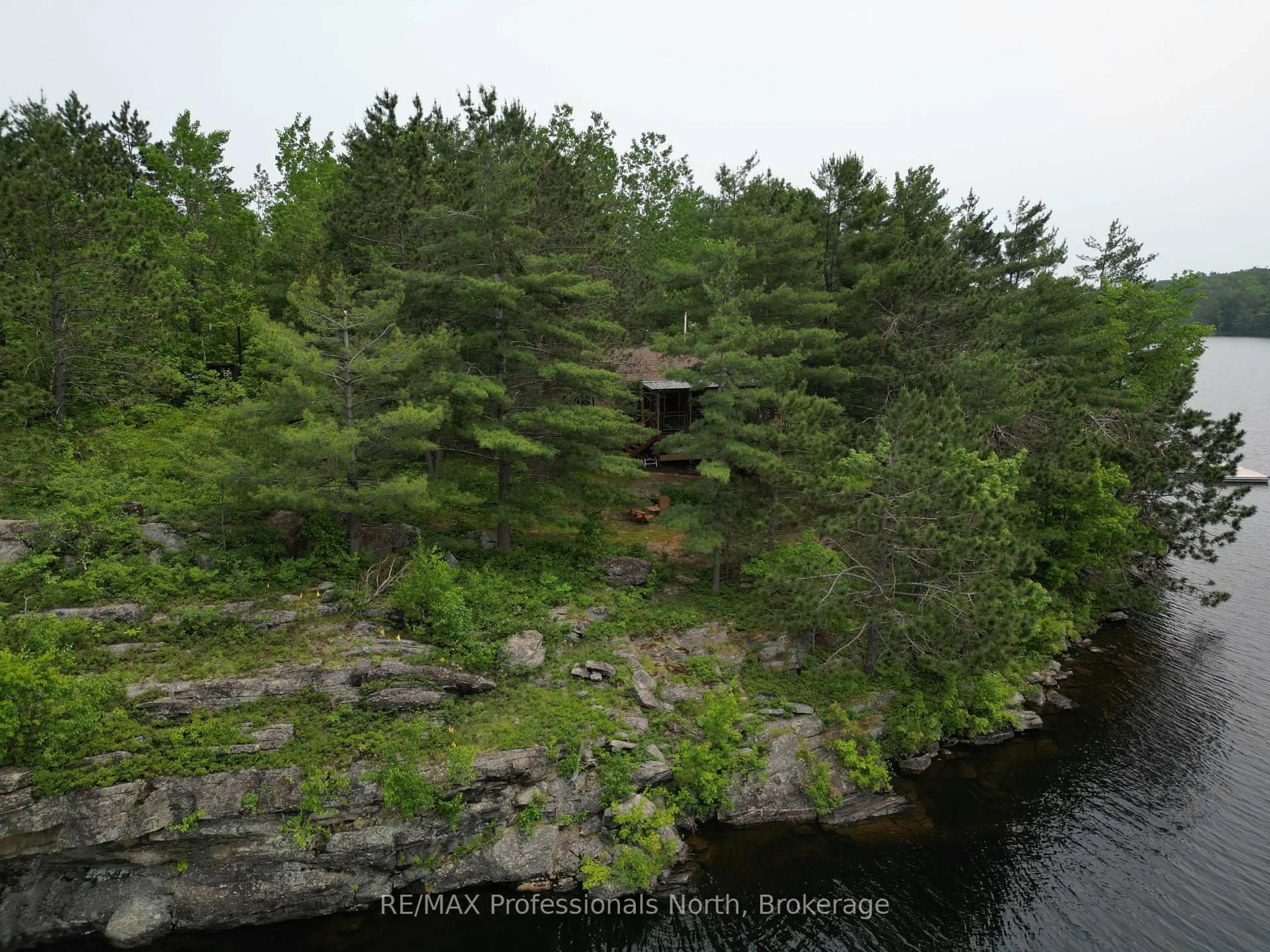 A pic from outside/outdoor area/front of a property/back of a property/a pic from drone, forest/trees view for 11437 Devils Lake WAO, Minden Hills Ontario K0M 2L1