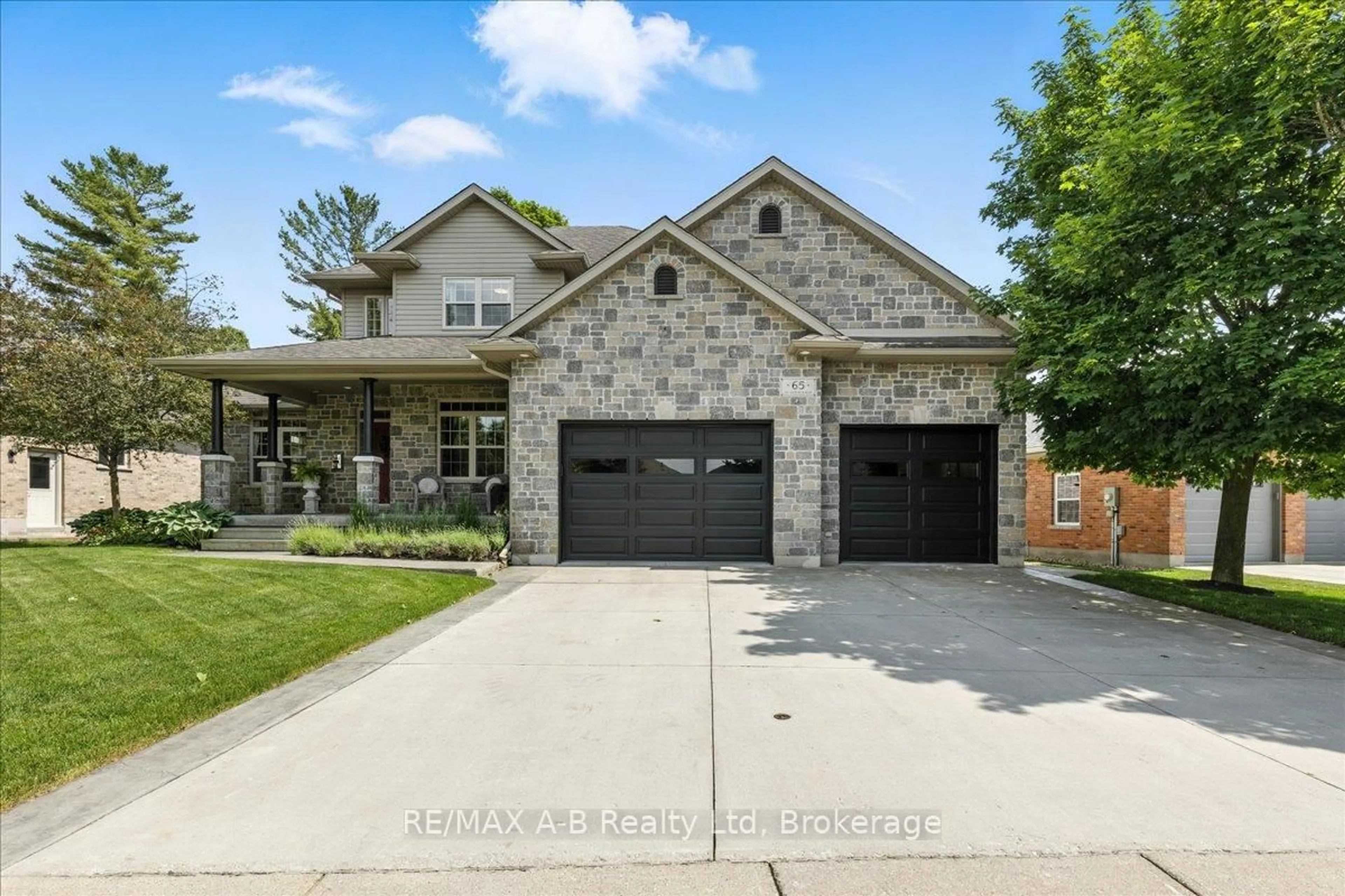 Home with brick exterior material, street for 65 Sir Adam Beck Rd, Stratford Ontario N5A 8B9