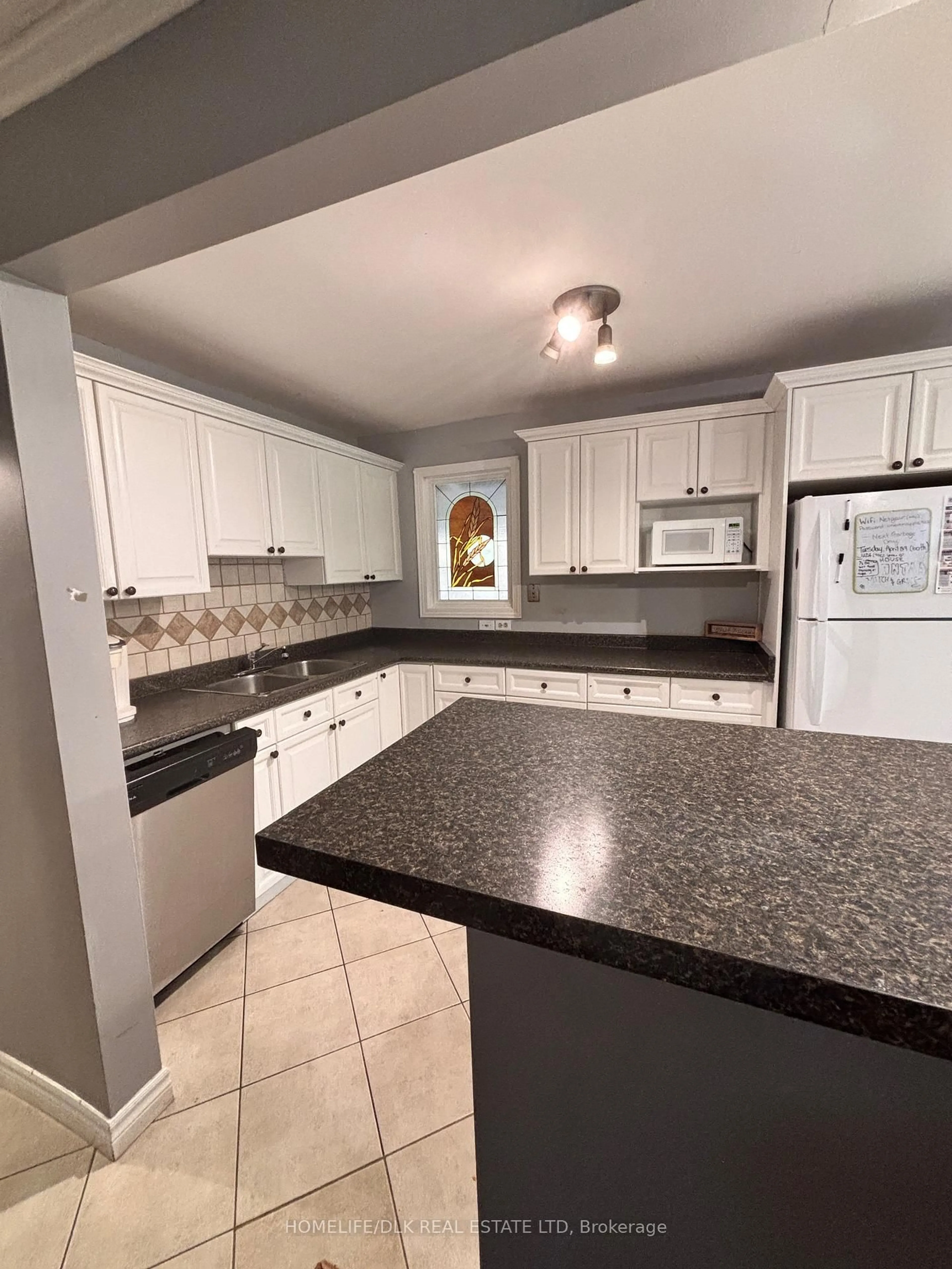 Open concept kitchen, ceramic/tile floor for 644 Grosvenor St, London East Ontario N5Y 3T4