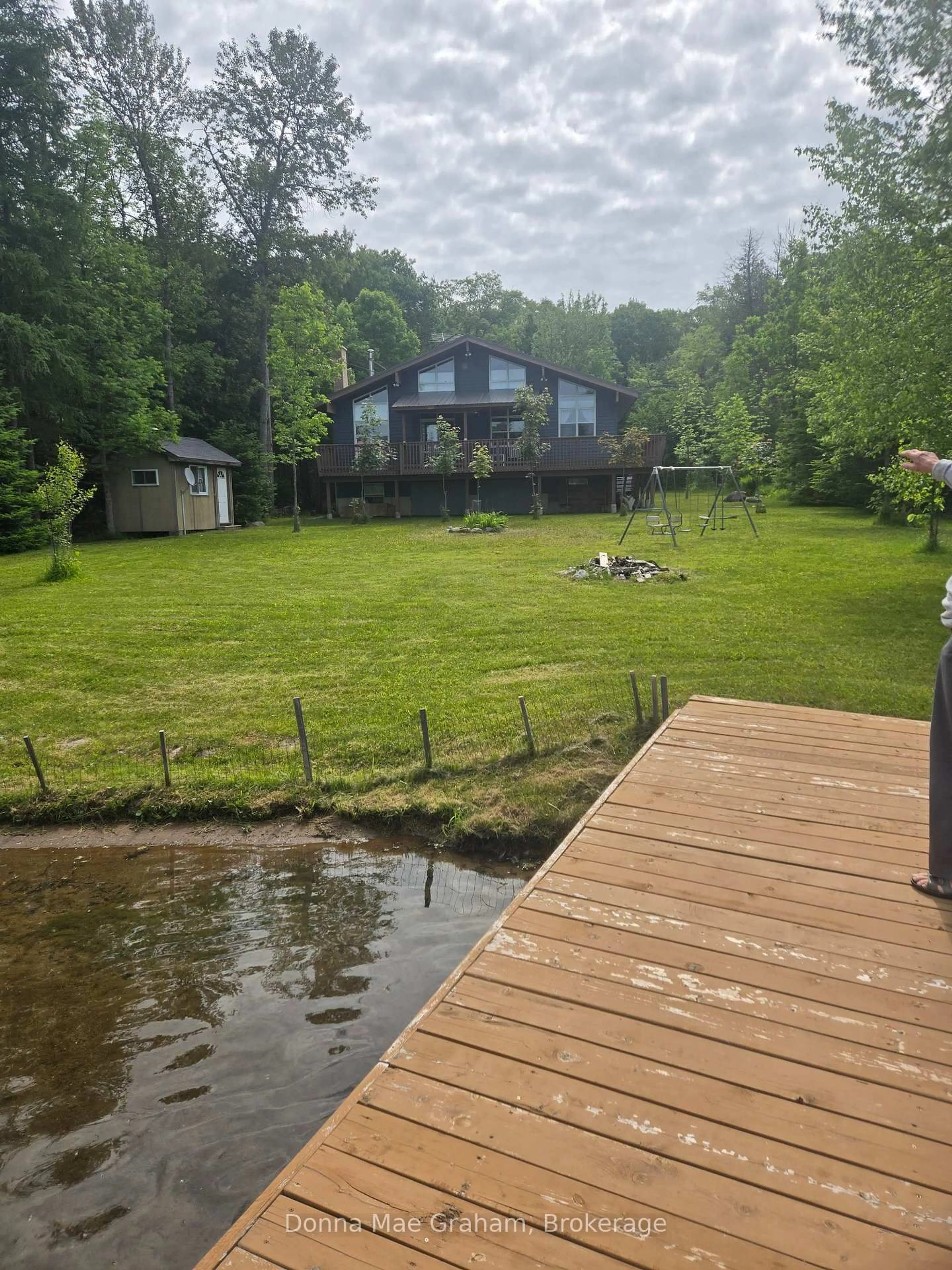 A pic from outside/outdoor area/front of a property/back of a property/a pic from drone, water/lake/river/ocean view for 1020 Granite Lane, Highlands East Ontario K0M 1R0