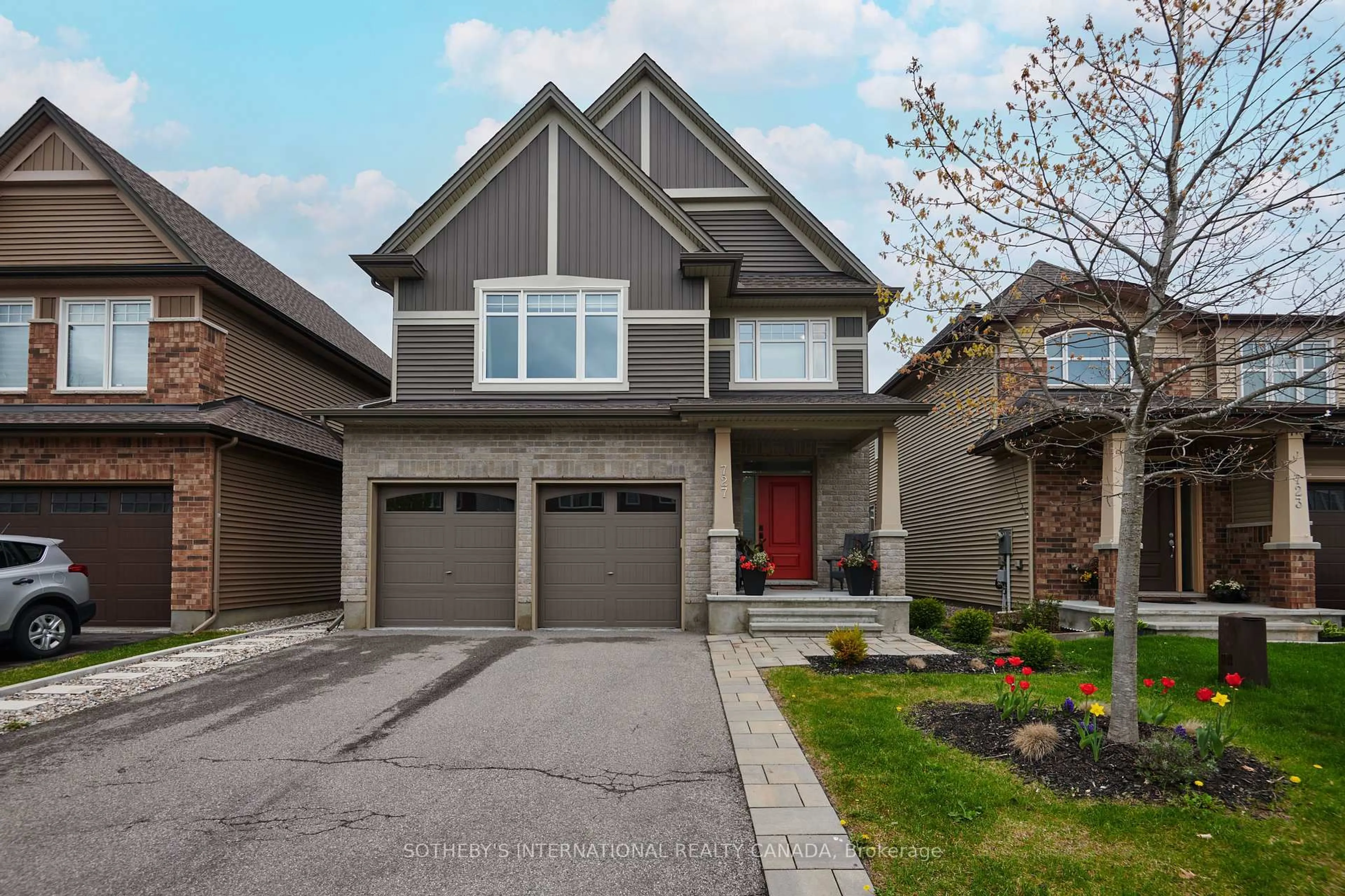 Home with brick exterior material, street for 727 Bunchberry Way, Ottawa Ontario K1T 3T8