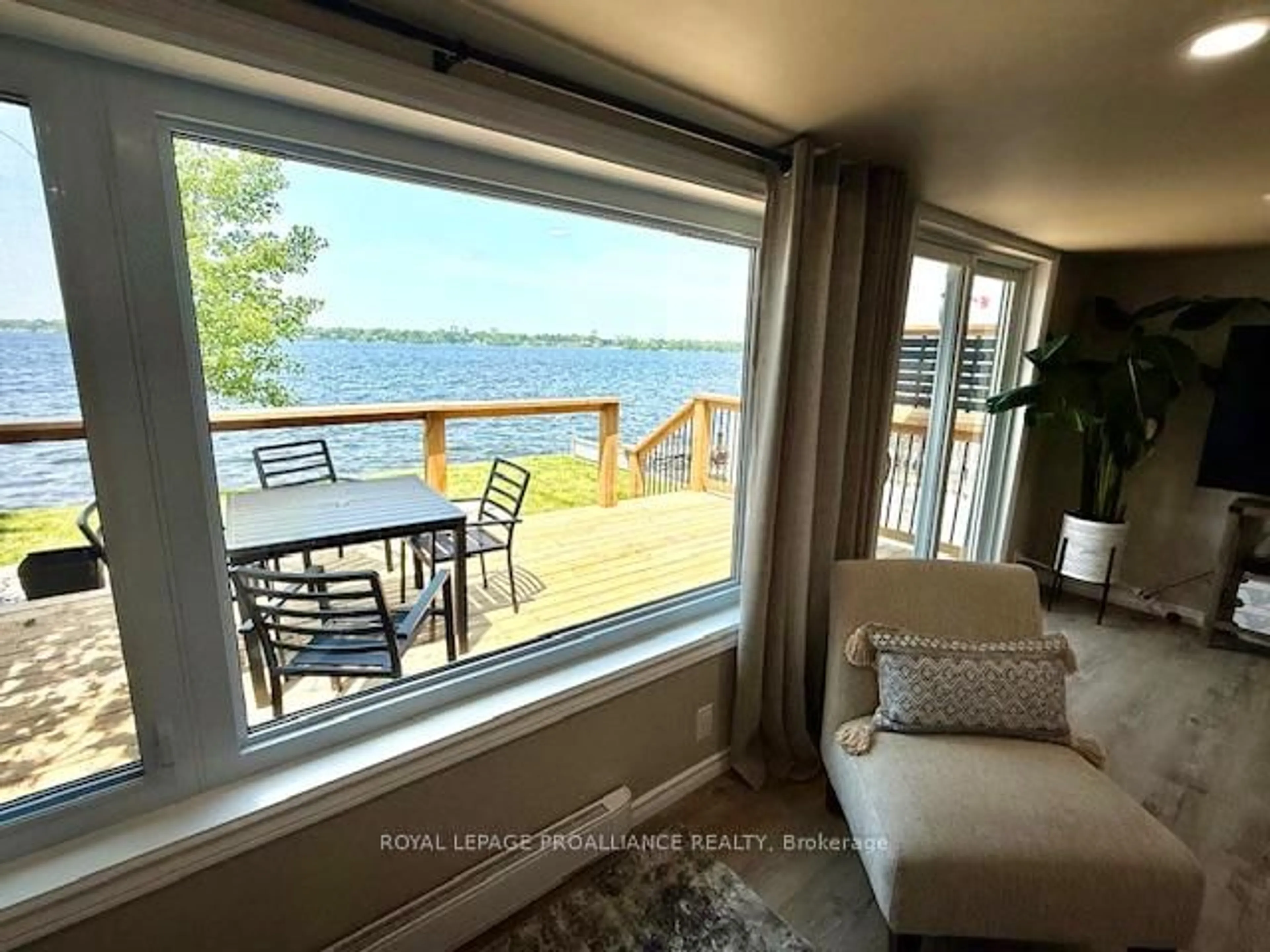 Living room with furniture, wood/laminate floor for 80 Ridley St, Prince Edward County Ontario K8N 4Z1