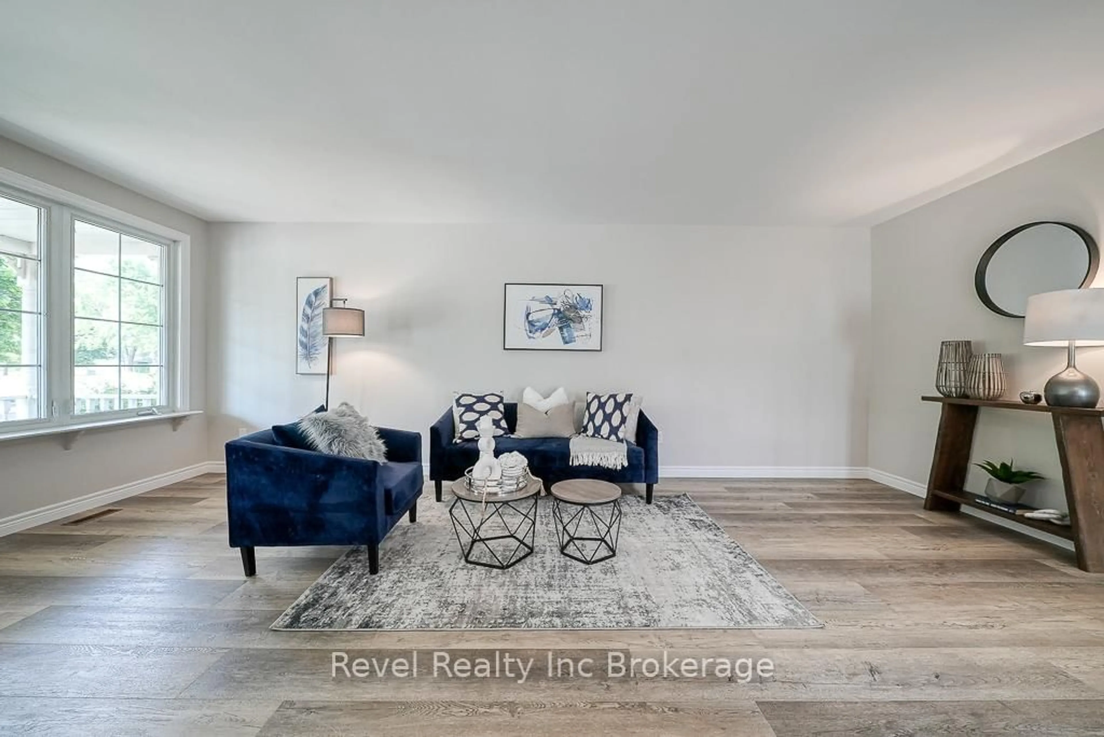 Living room with furniture, wood/laminate floor for 751 Classic Dr, London East Ontario N5W 5V8
