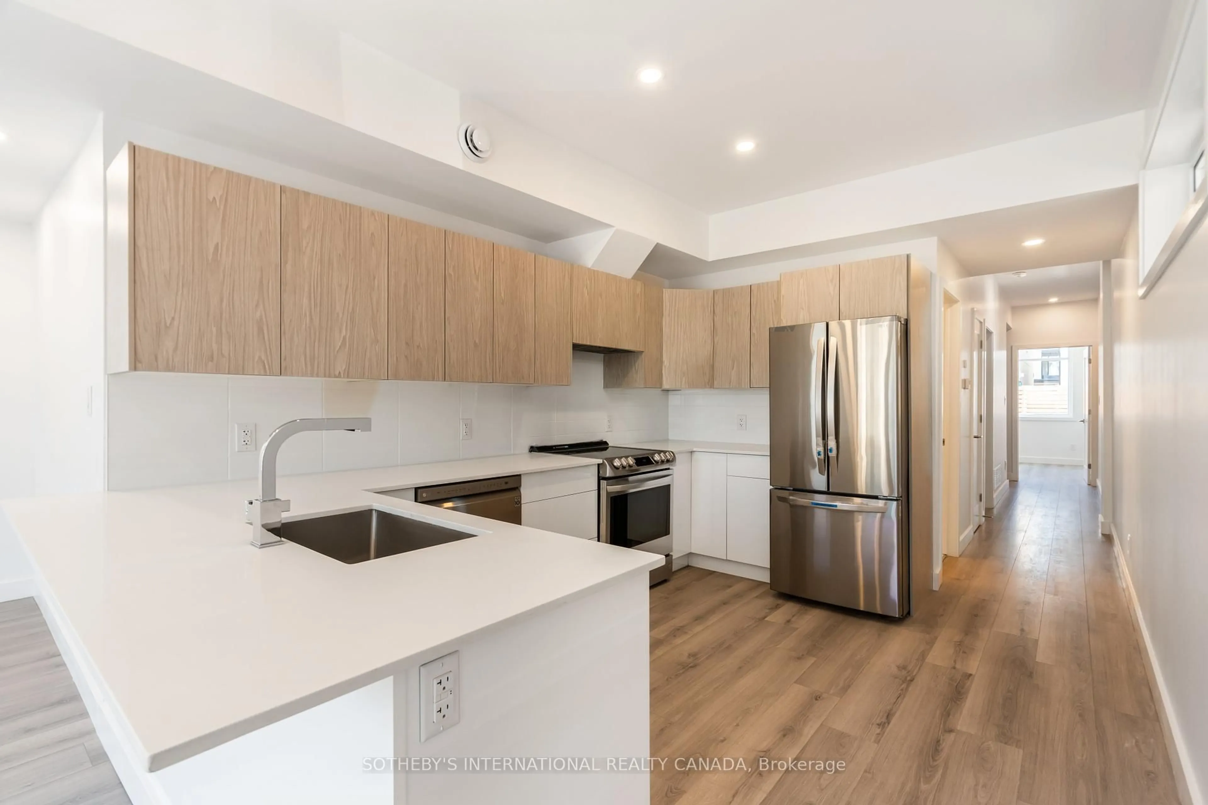 Open concept kitchen, wood/laminate floor for 288 Duncairn Ave, Ottawa Ontario K1Z 7G9