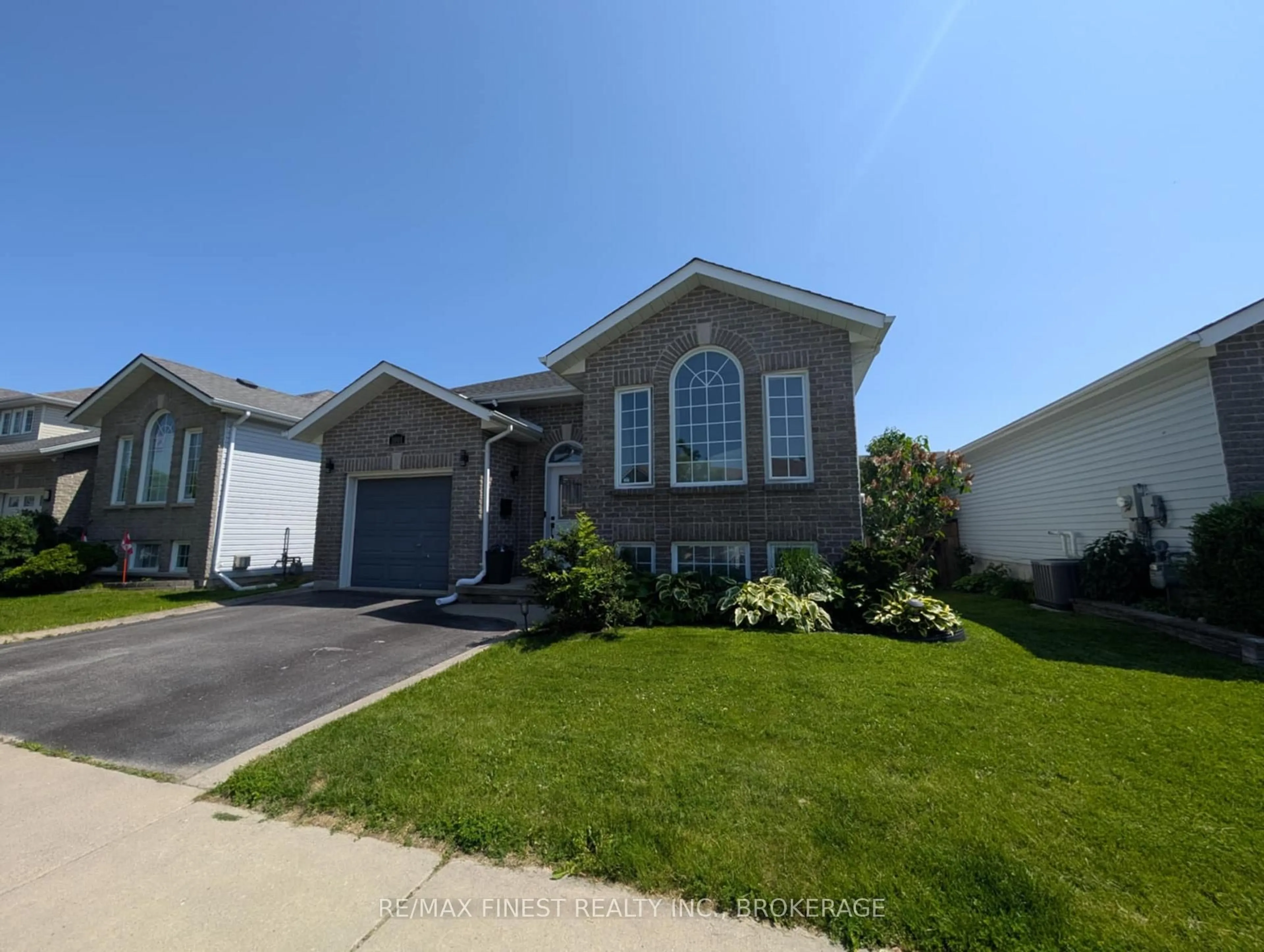 Home with vinyl exterior material, street for 1001 Bluffwood Ave, Kingston Ontario K7K 7K6