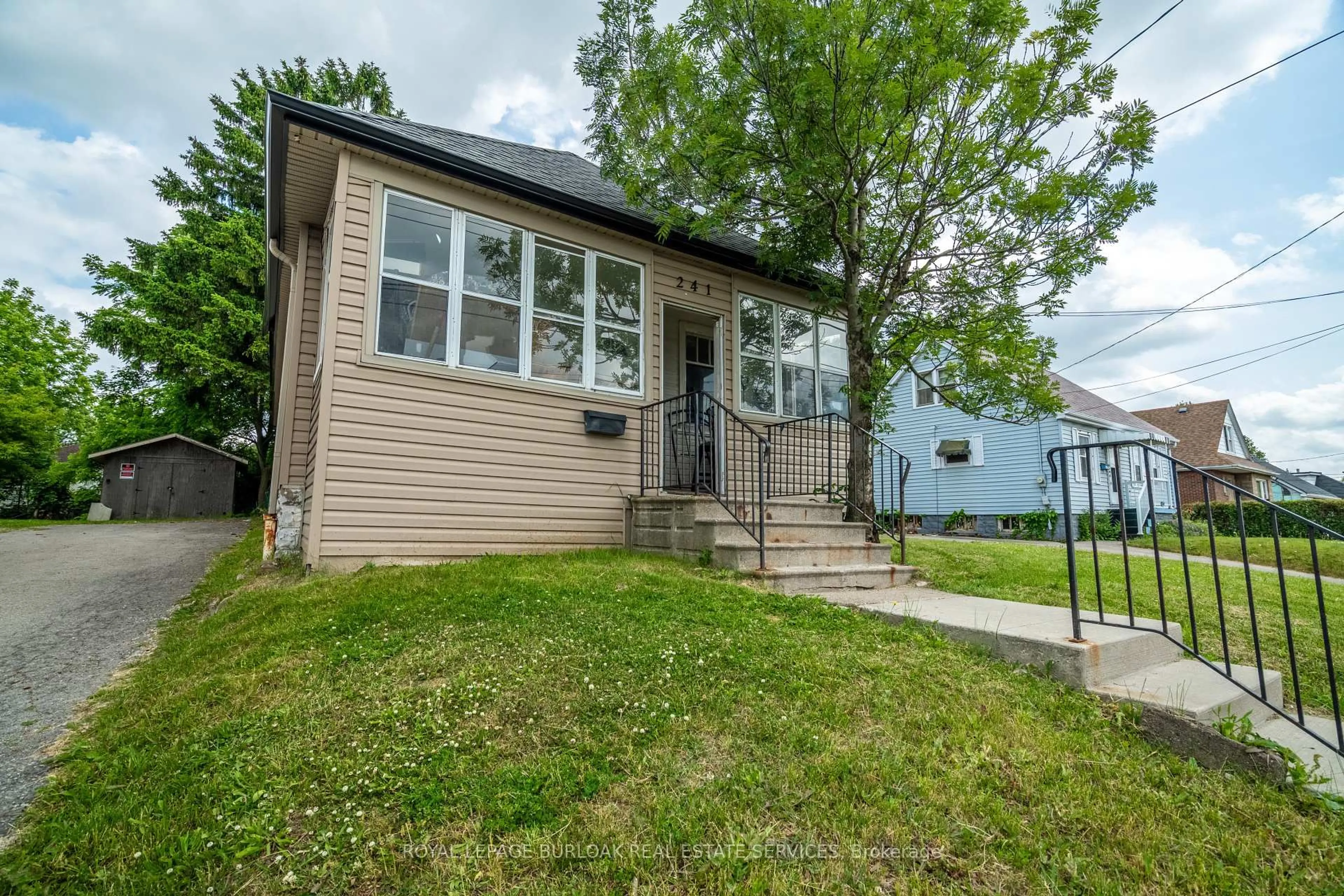 Home with vinyl exterior material, street for 241 West 5th St, Hamilton Ontario L9C 3N8
