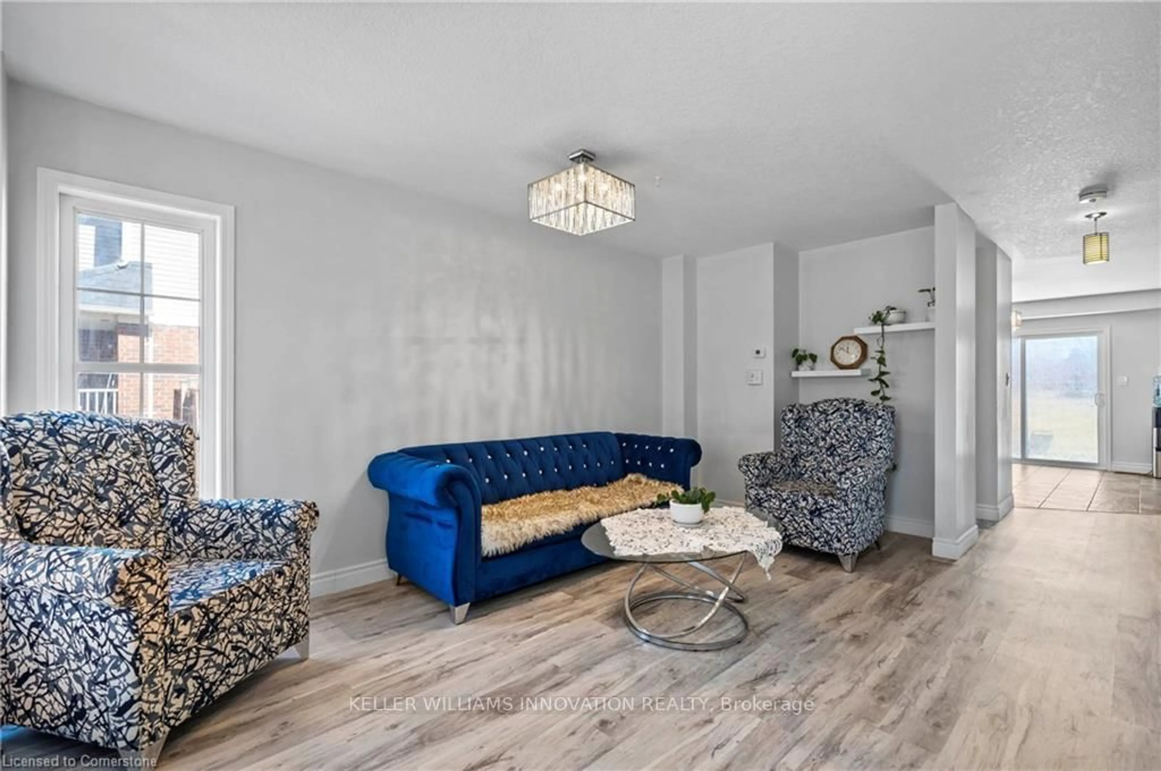 Living room with furniture, wood/laminate floor for 159 Norwich Rd, Woolwich Ontario N0B 1M0
