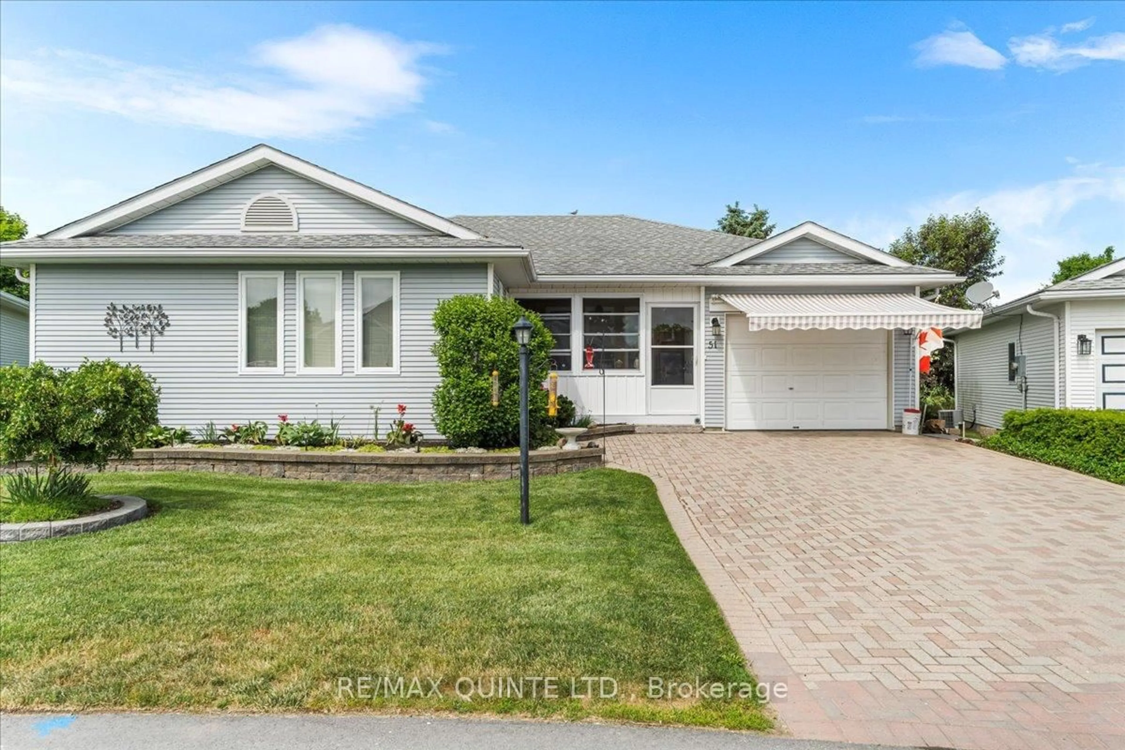 Home with vinyl exterior material, street for 51 Cretney Dr, Prince Edward County Ontario K0K 3L0