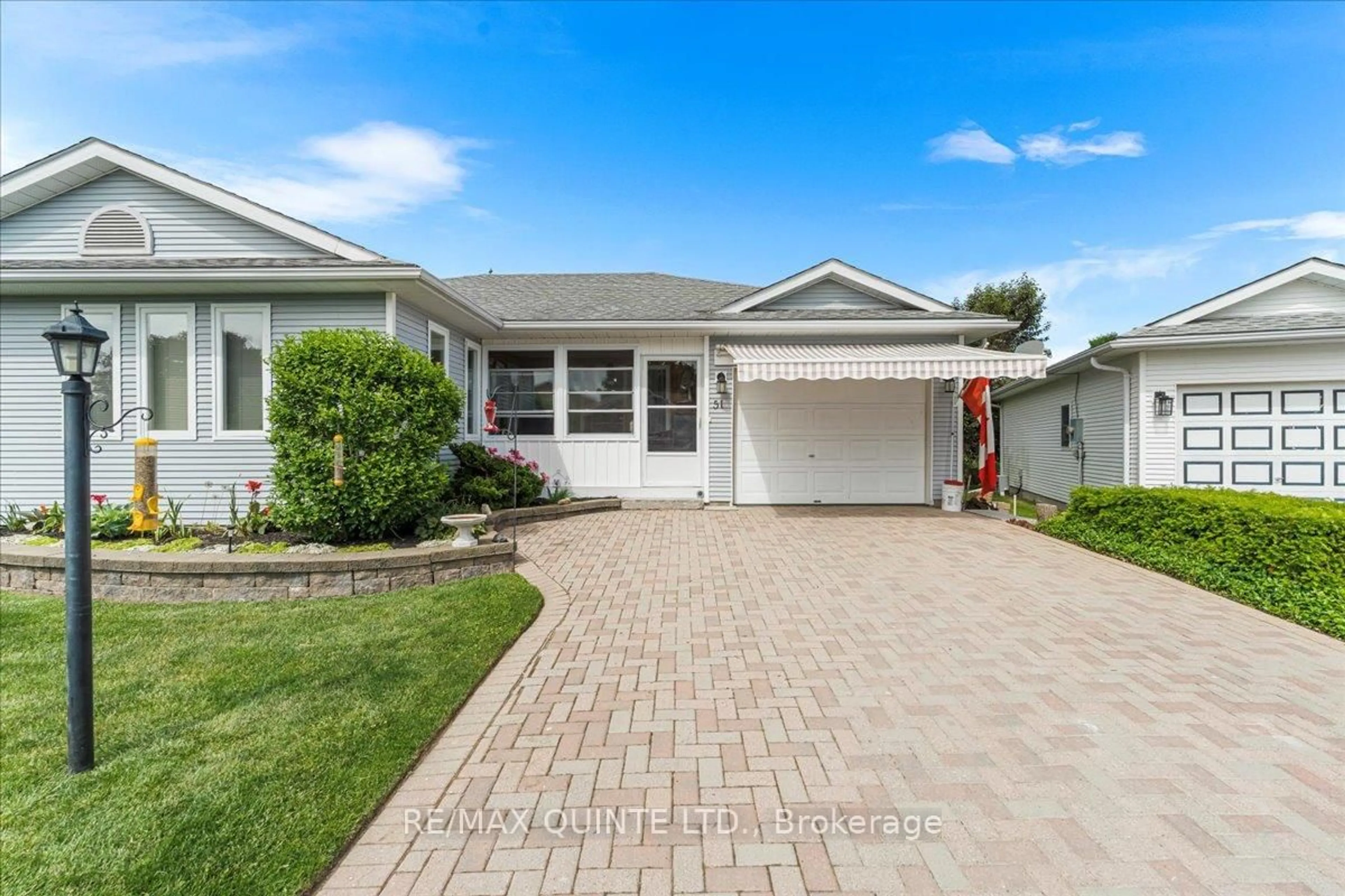 Home with vinyl exterior material, street for 51 Cretney Dr, Prince Edward County Ontario K0K 3L0