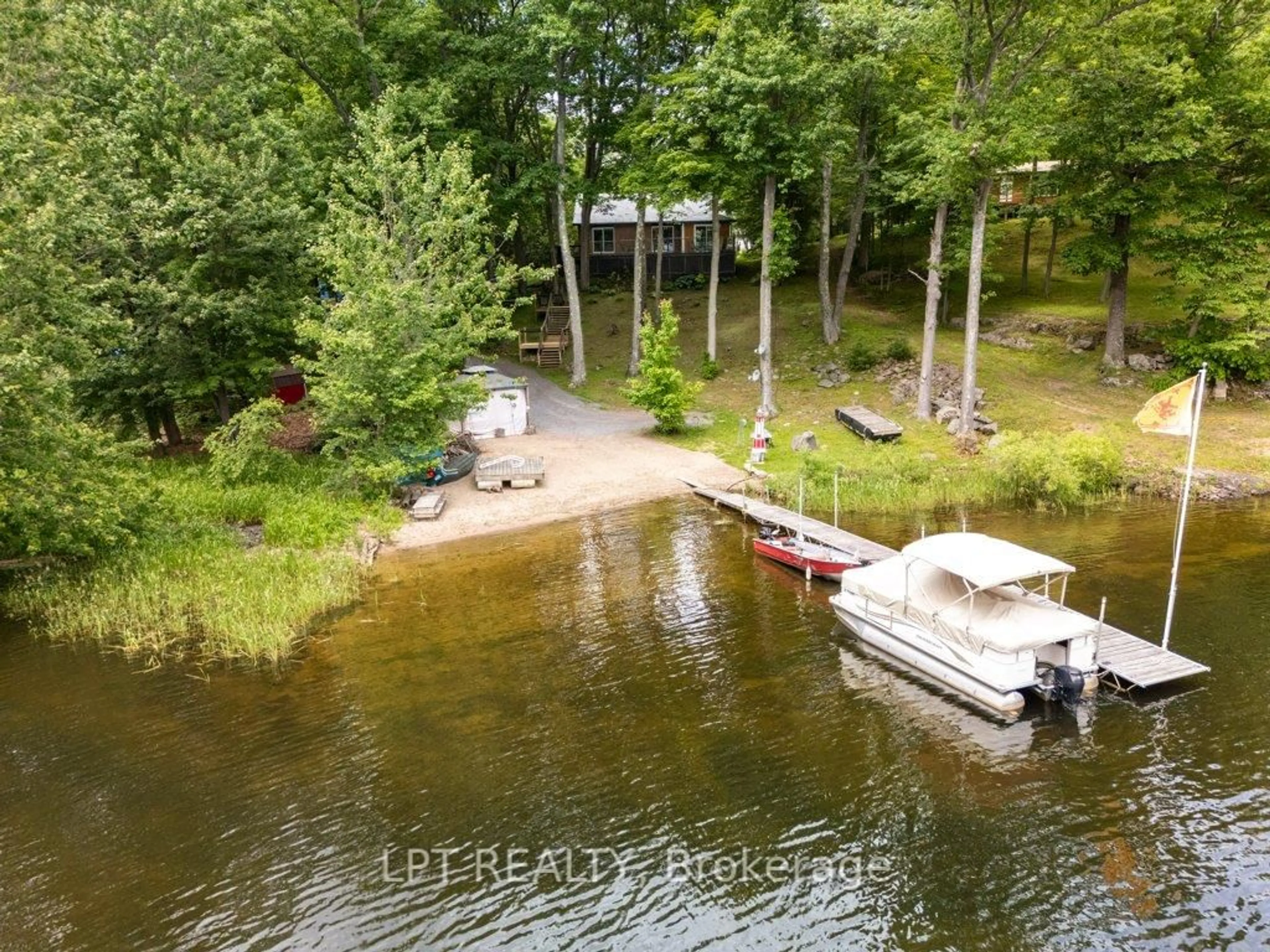 A pic from outside/outdoor area/front of a property/back of a property/a pic from drone, water/lake/river/ocean view for 31 Acorn Lane, Tichborne Ontario K0H 2V0