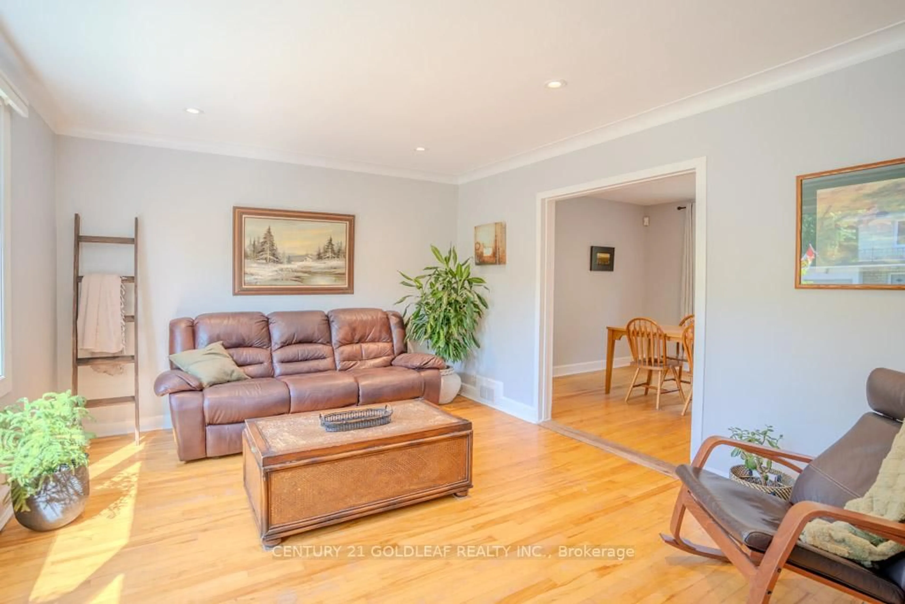 Living room with furniture, wood/laminate floor for 9 Queen Mary St, Ottawa Ontario K1K 1Y1