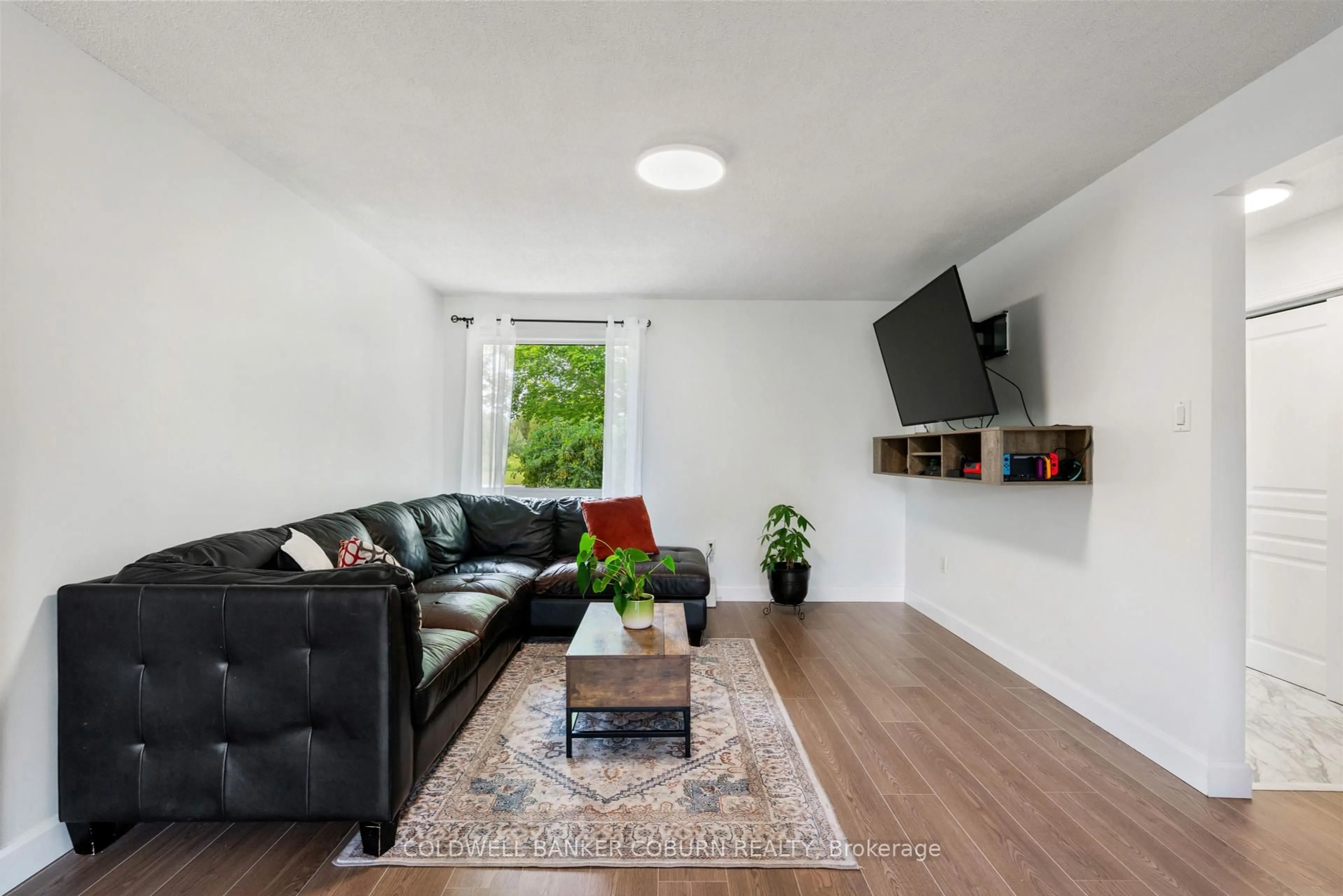Living room with furniture, wood/laminate floor for 852 County Road 44 Rd, North Grenville Ontario K0G 1J0