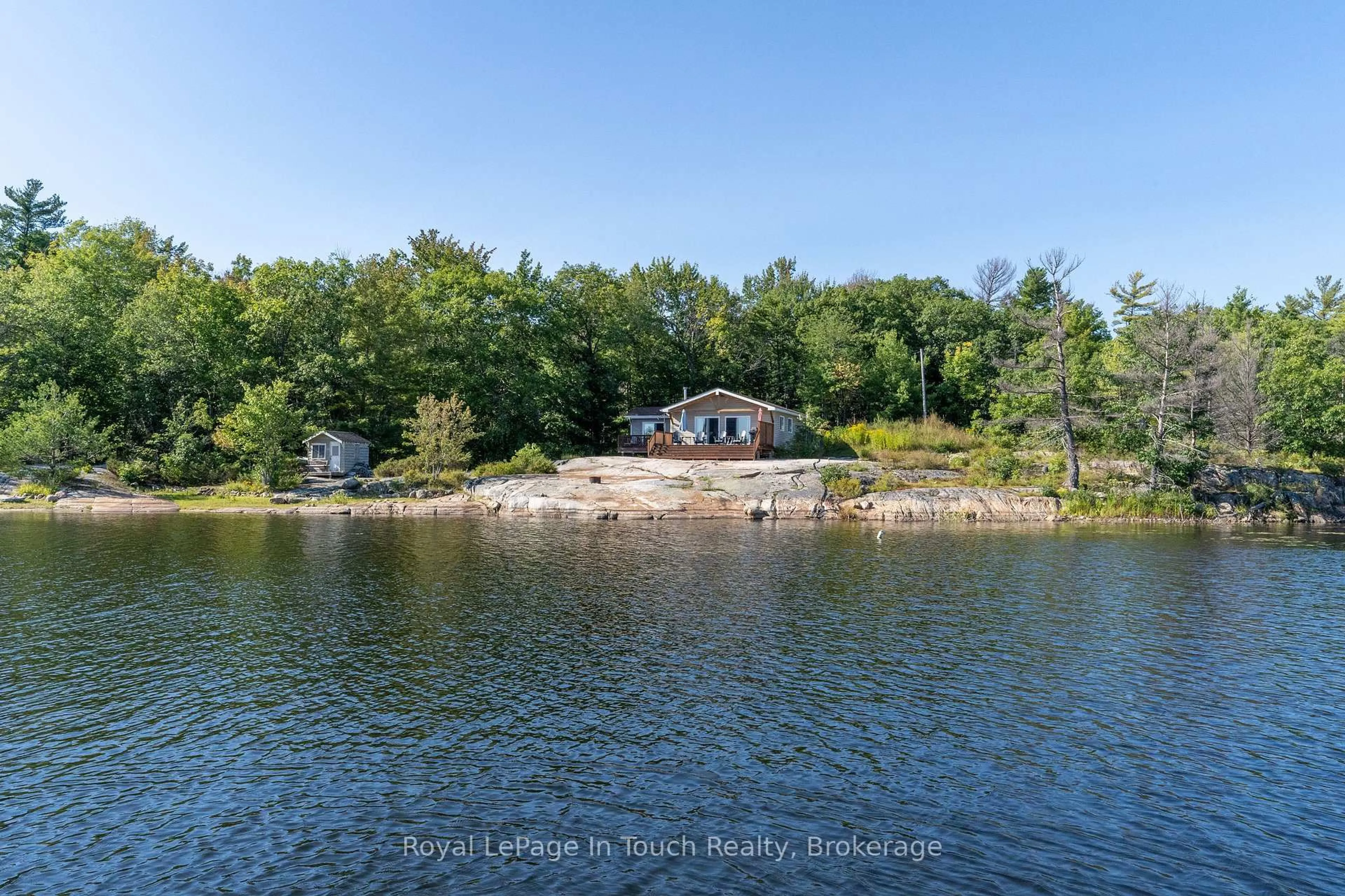 A pic from outside/outdoor area/front of a property/back of a property/a pic from drone, water/lake/river/ocean view for 6980 Island 1810, Georgian Bay Ontario P0E 1E0