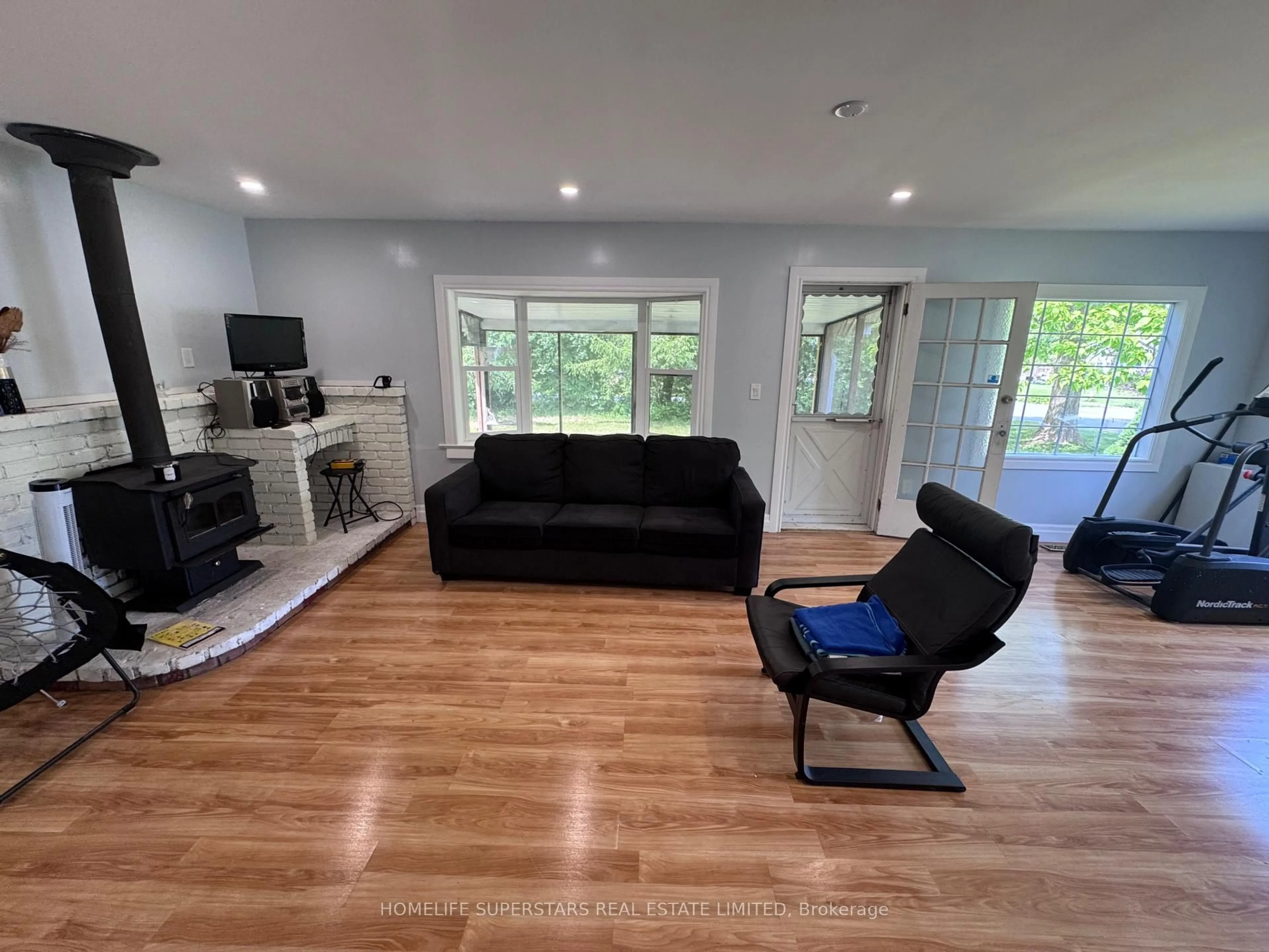 Living room with furniture, wood/laminate floor for 97 Bernard Ave, Fort Erie Ontario L0S 1N0