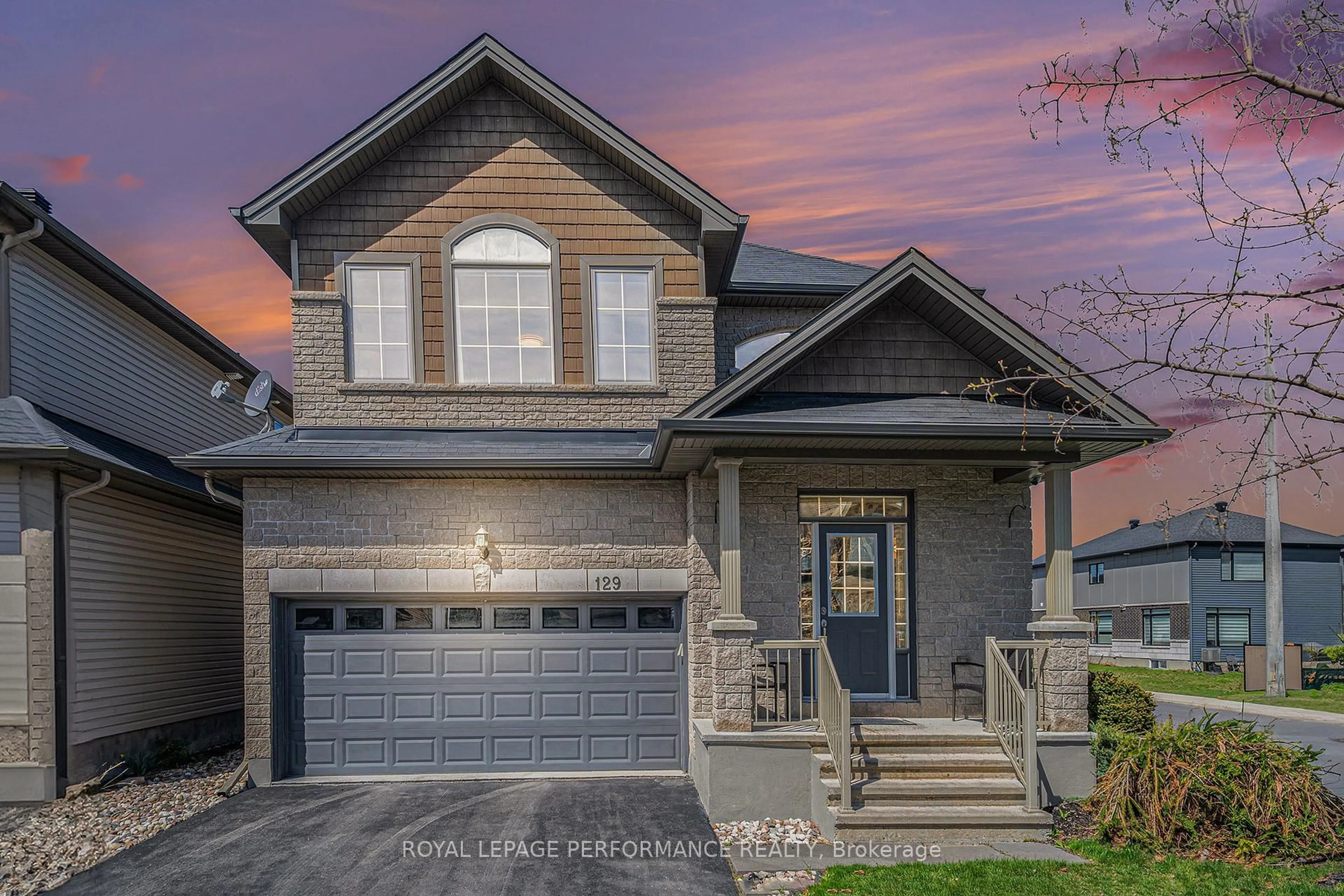 Home with brick exterior material, street for 129 Winterhaven Dr, Ottawa Ontario K1W 0H4