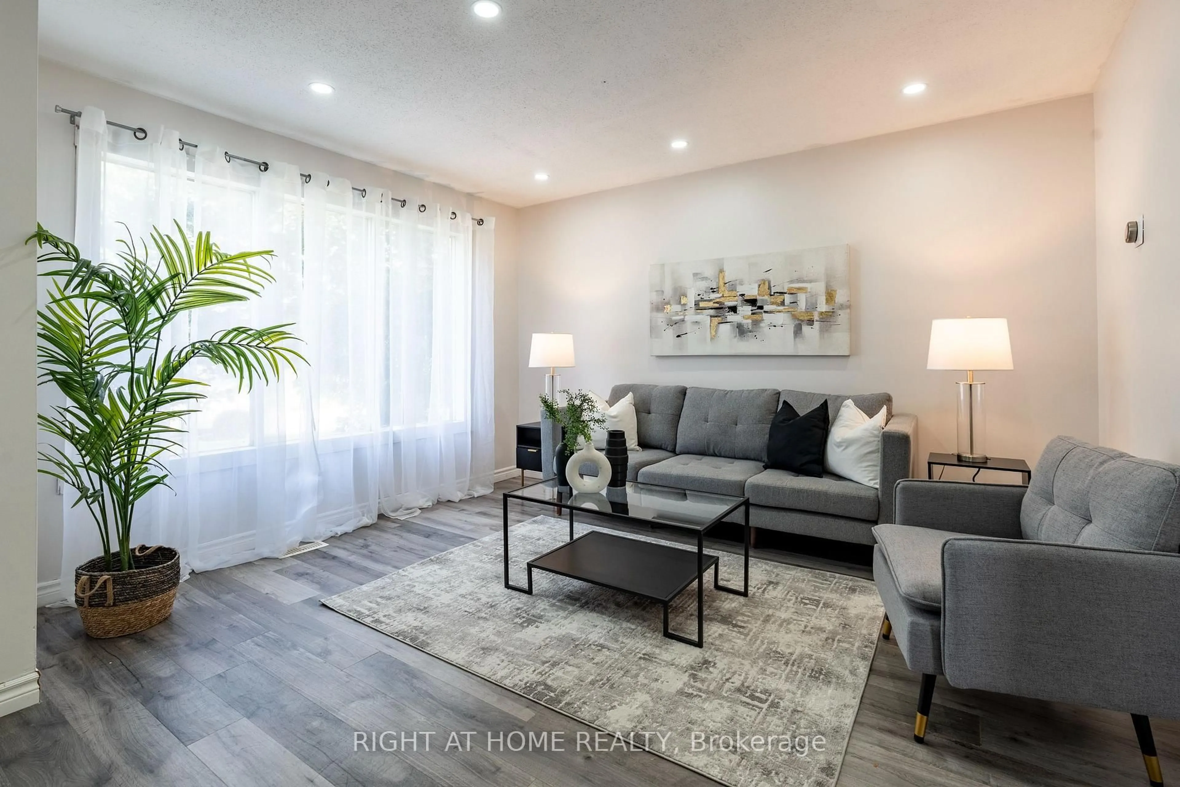 Living room with furniture, wood/laminate floor for 59 Winter Ave, Cambridge Ontario N1R 5Z7