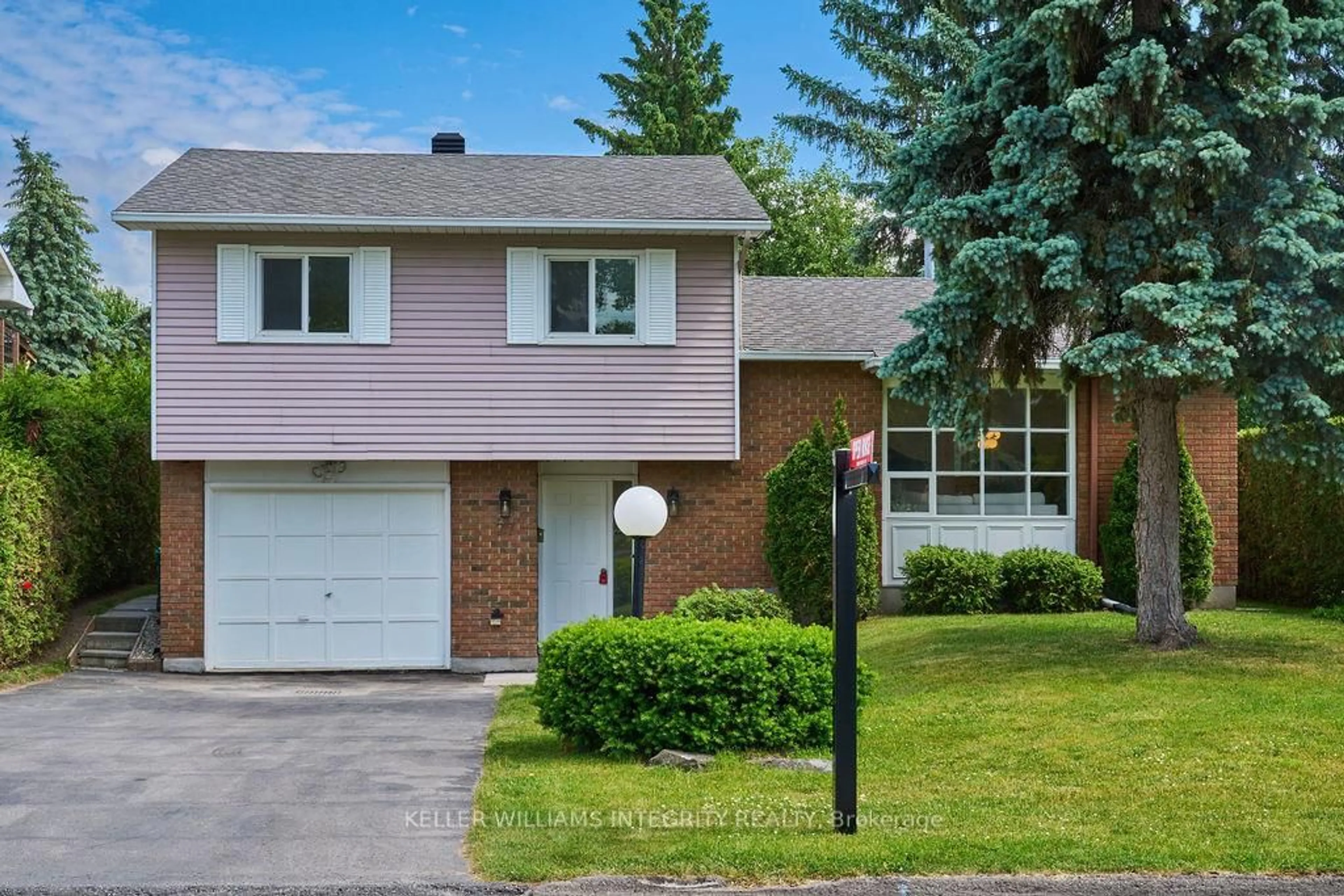 Home with brick exterior material, street for 77 Seabrooke Dr, Ottawa Ontario K2L 2K4