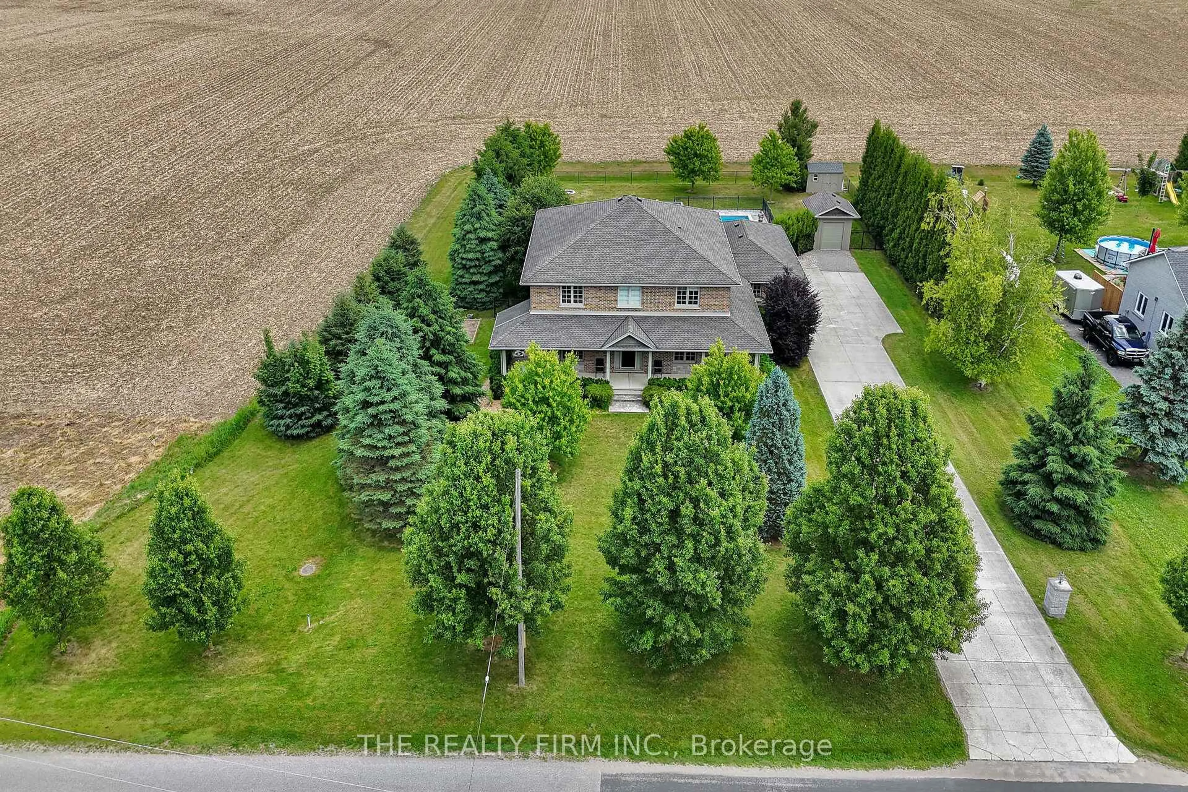 A pic from outside/outdoor area/front of a property/back of a property/a pic from drone, street for 24482 Poplar Hill Rd, Middlesex Centre Ontario N0M 2A0
