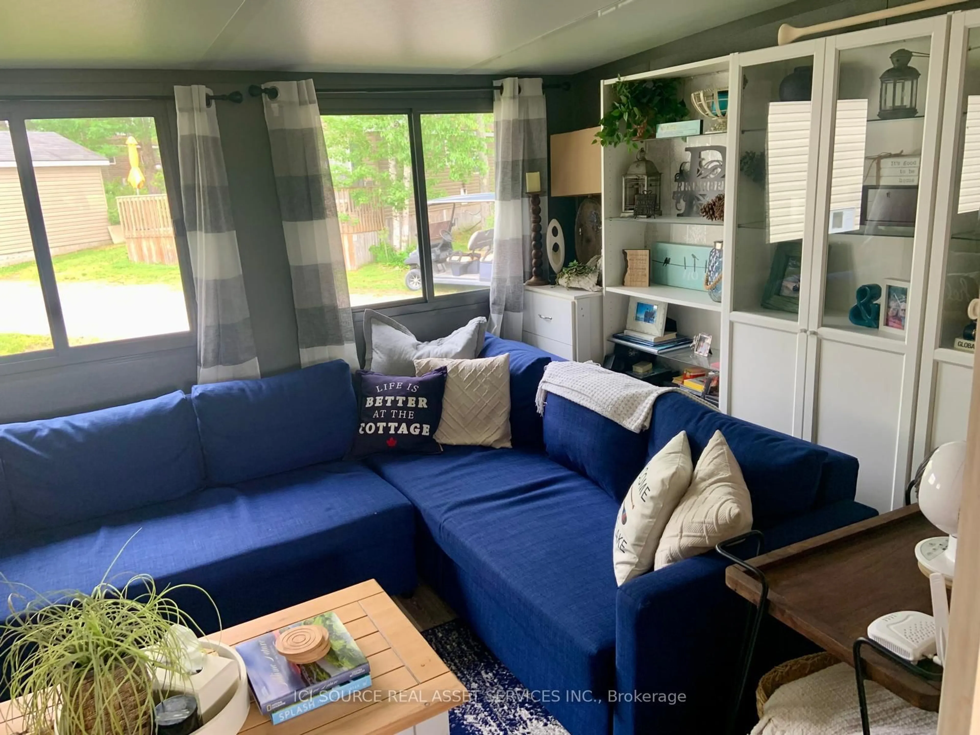 Living room with furniture, wood/laminate floor for 1336 S Morrison Lake Rd #RSV026, Gravenhurst Ontario P0E 1G0