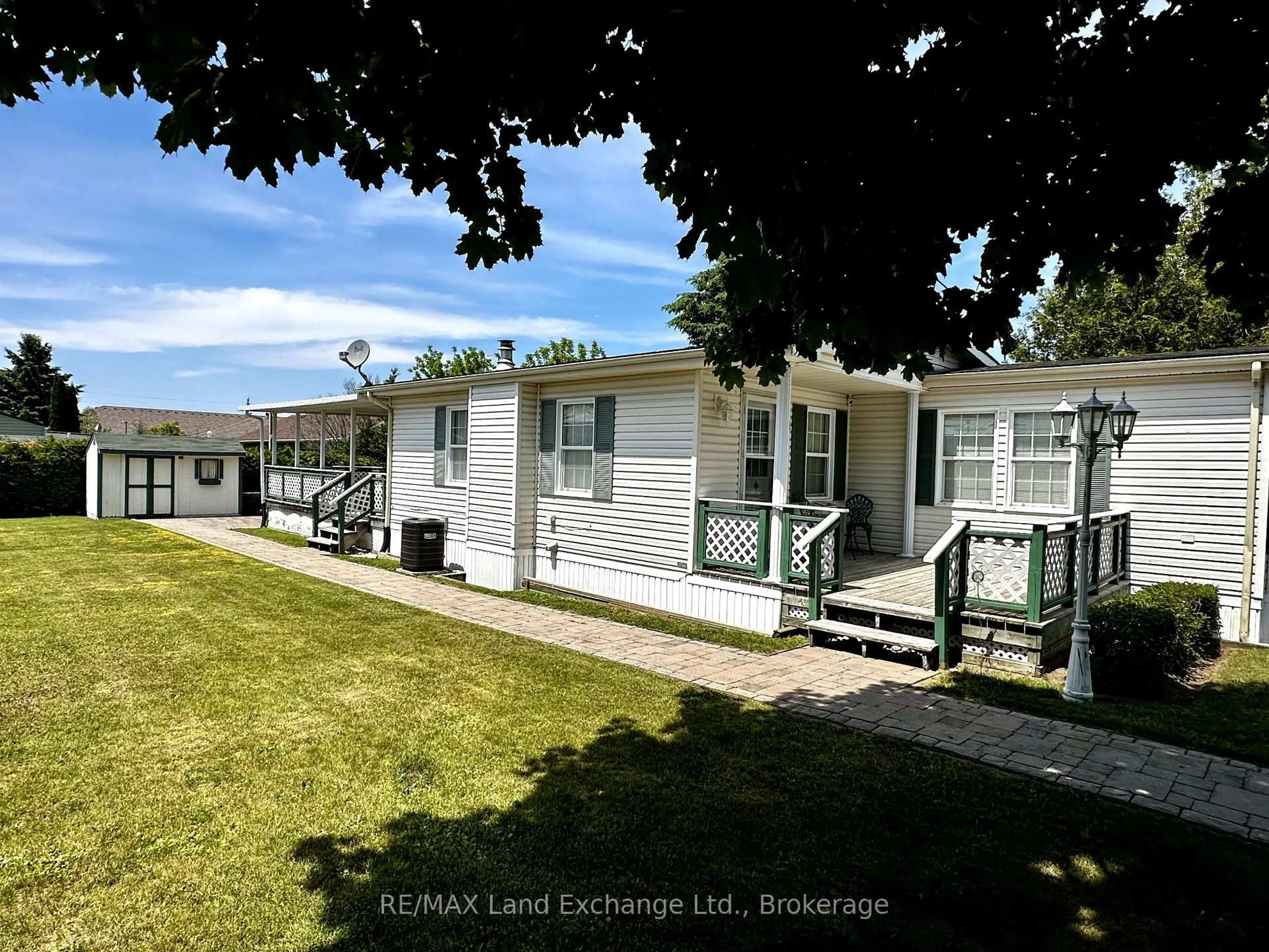 A pic from outside/outdoor area/front of a property/back of a property/a pic from drone, street for 332 Concession 6 Rd #11, Saugeen Shores Ontario N0H 2C7