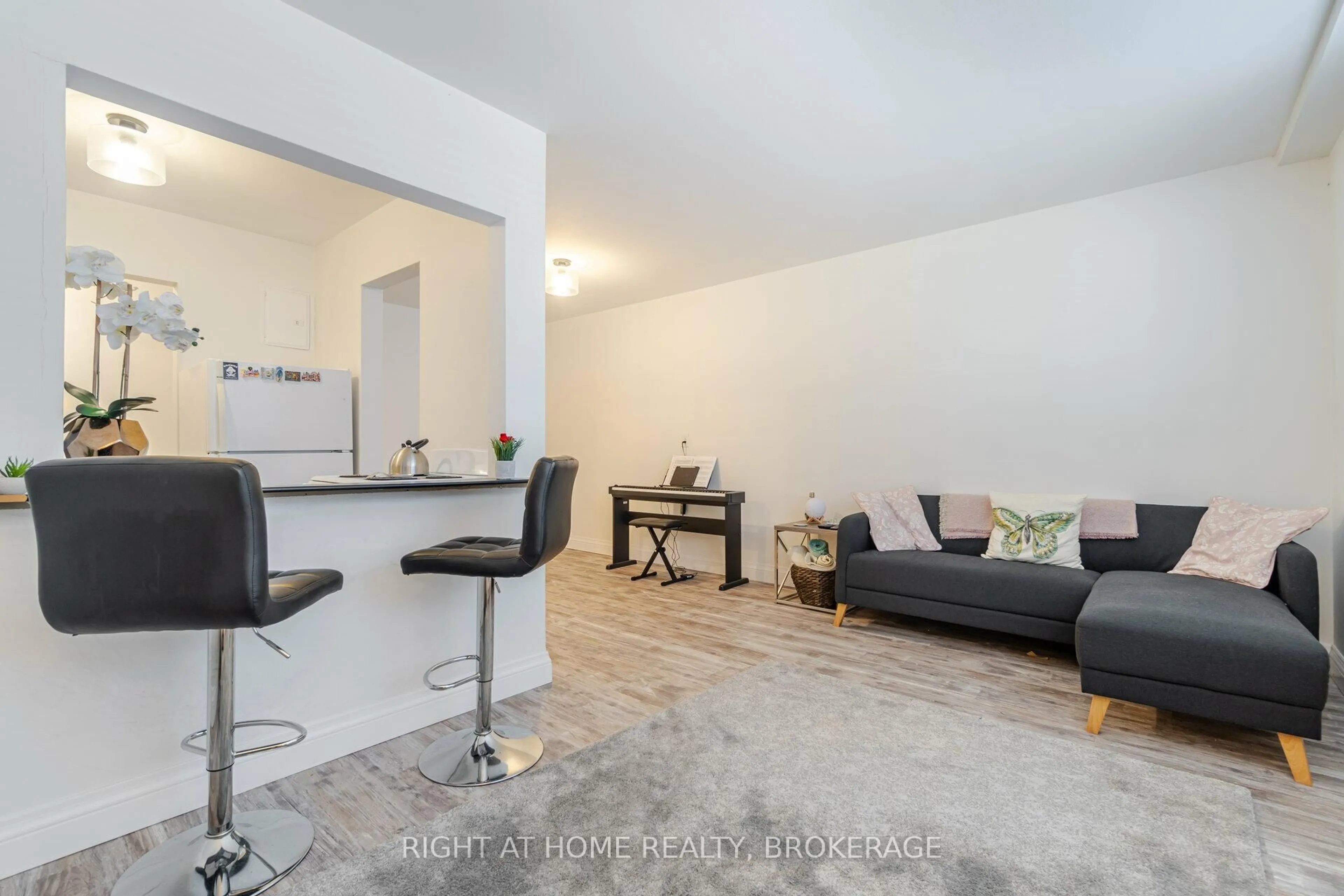 Living room with furniture, unknown for 57 Mericourt Rd #103, Hamilton Ontario L8S 2N5