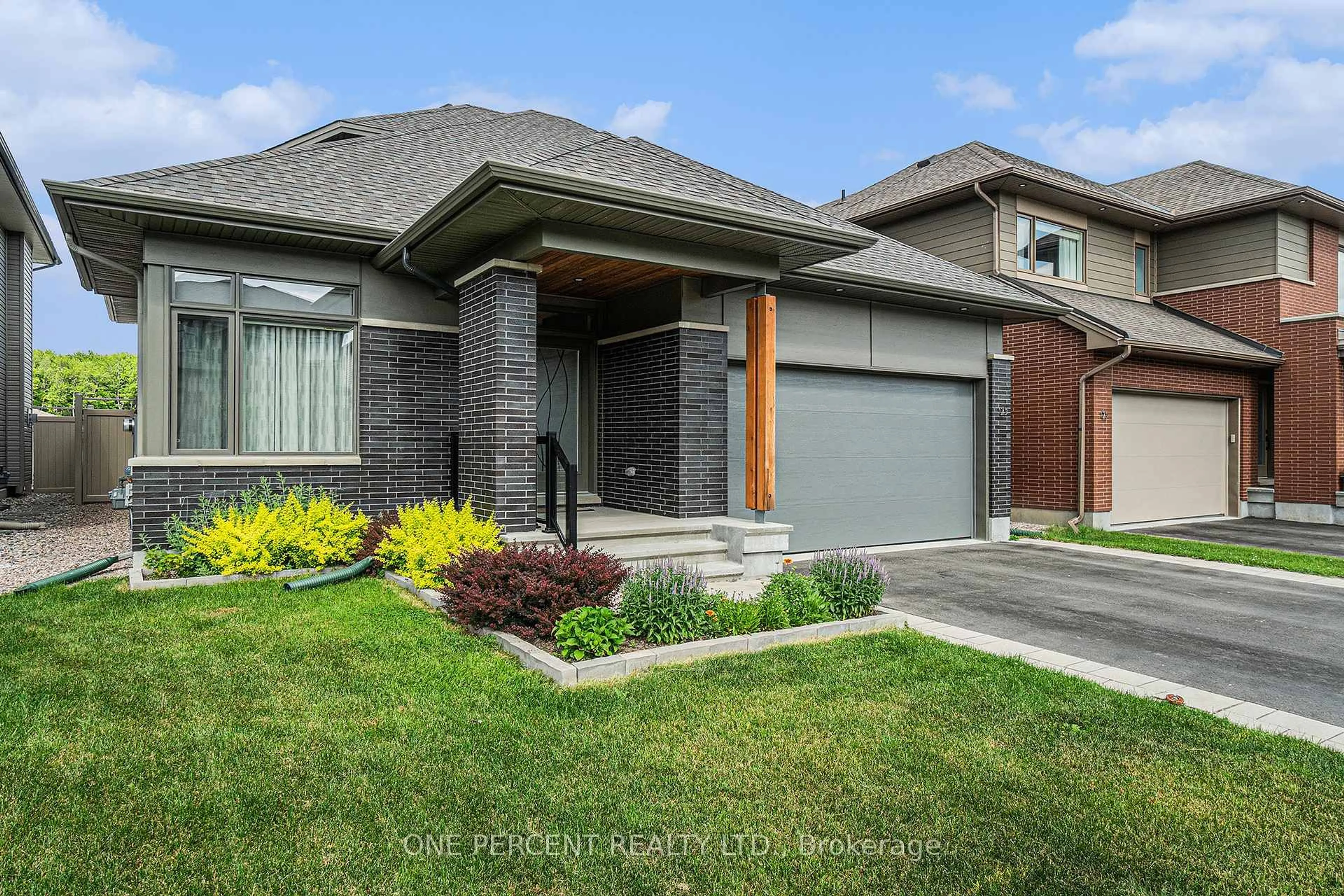 Home with brick exterior material, street for 123 Pathfinder Way, Ottawa Ontario K1X 0C9