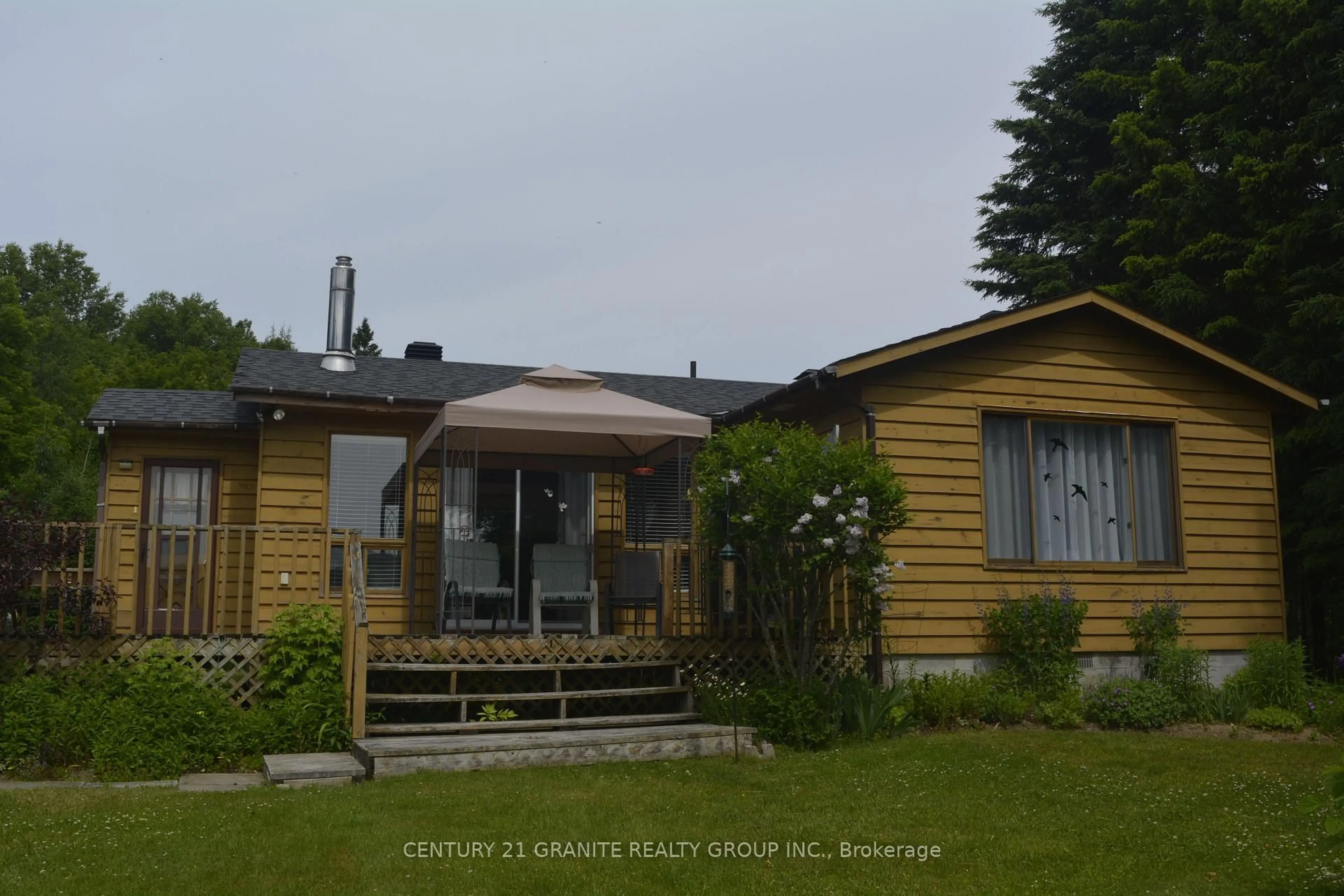 A pic from outside/outdoor area/front of a property/back of a property/a pic from drone, street for 3338 South Baptiste Lake Rd, Highlands East Ontario K0L 2A0