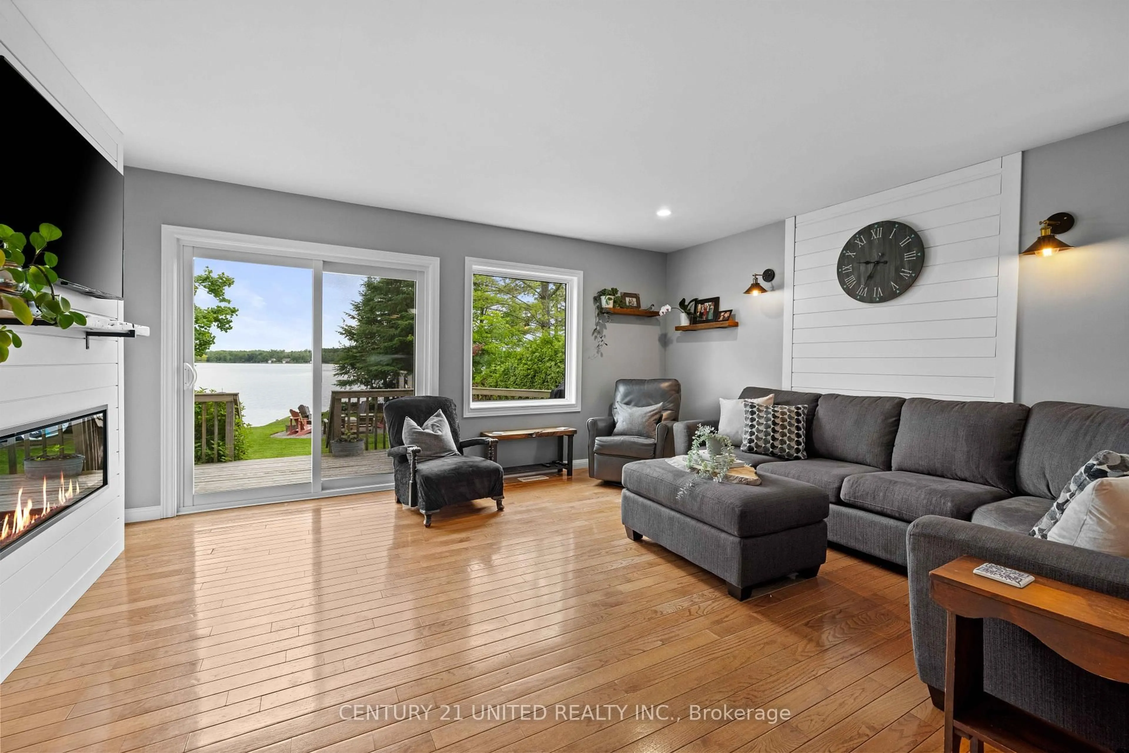 Living room with furniture, wood/laminate floor for 586 Birch Point Rd, Kawartha Lakes Ontario K0M 2T0