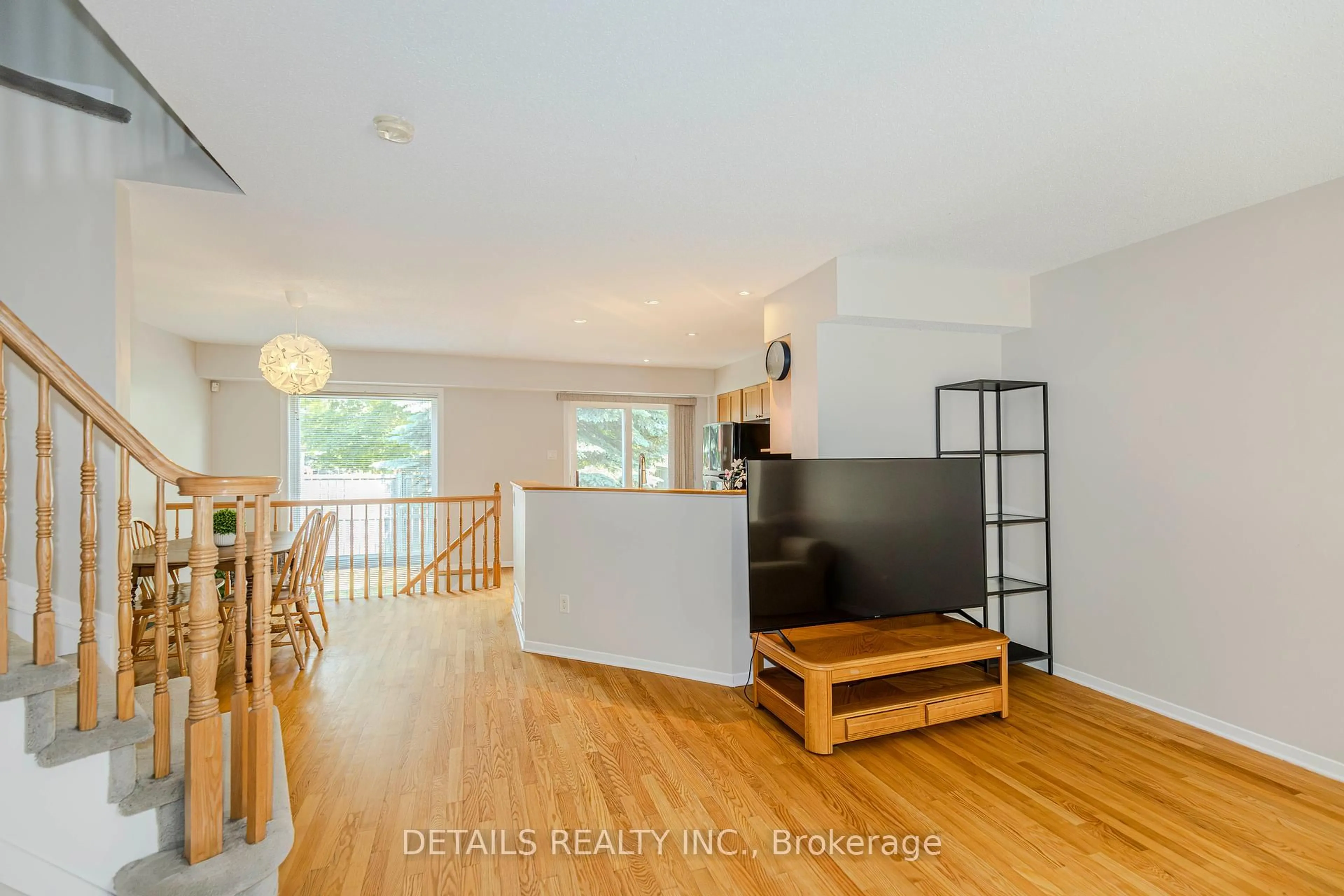 Living room with furniture, wood/laminate floor for 64 Scout St, Ottawa Ontario K2C 4C4