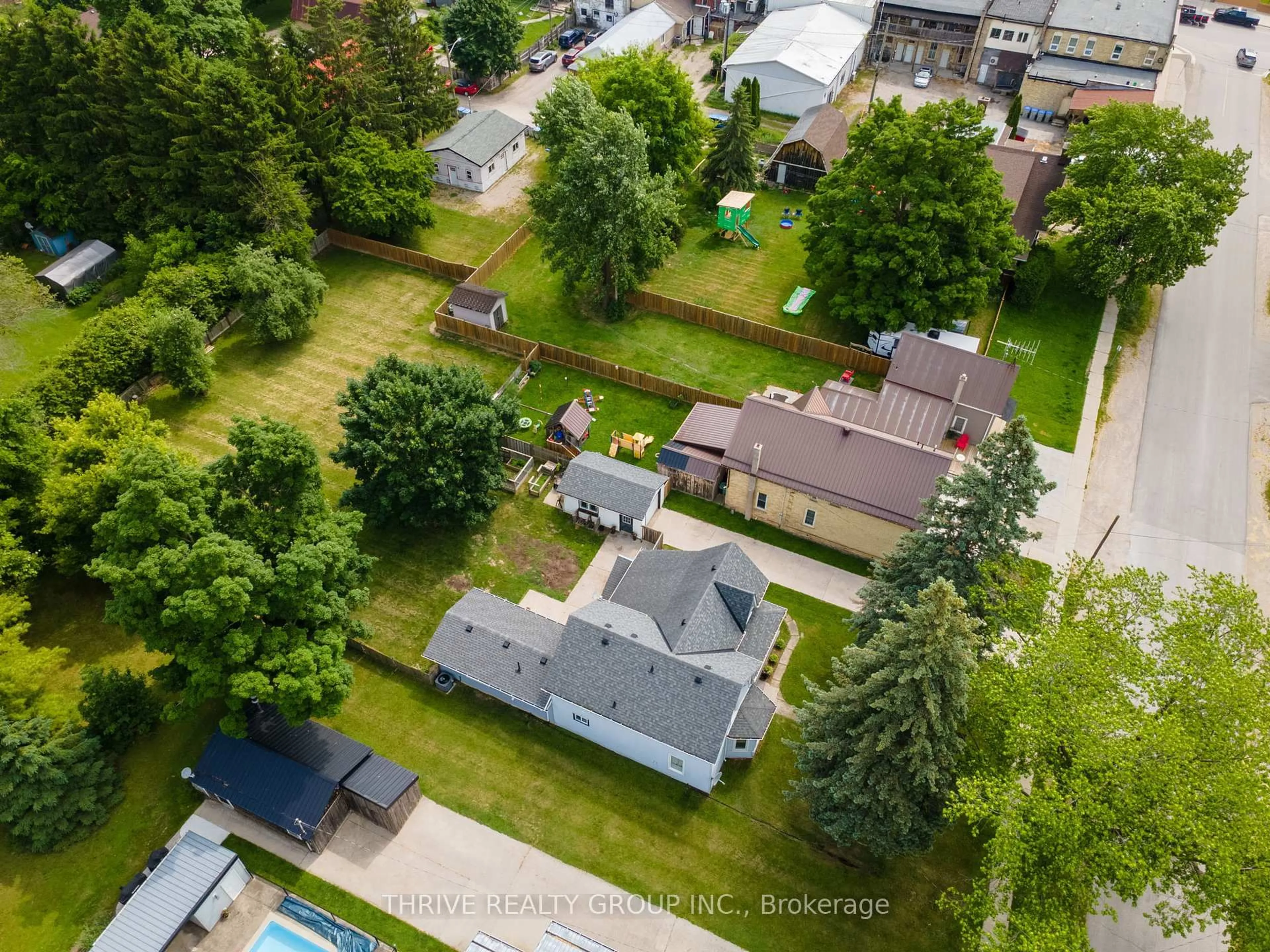 A pic from outside/outdoor area/front of a property/back of a property/a pic from drone, street for 176 Mill St, North Middlesex Ontario N0M 2K0